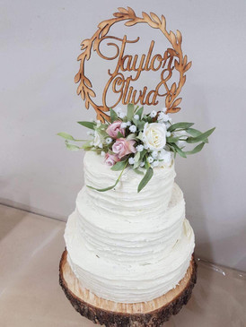 Elegant Wedding Cake.  Dark Chocolate mud cake with white chocolate ganache.  10", 8", 6" to feed 150 people.