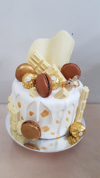 Beautiful White Choc with Macrons Drip cake