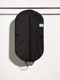 Picture of the inside of a black handled suit cover bag with accessory shirt pocket
