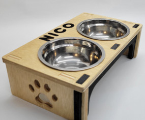 Modern wooden pet bowl stand with two metallic bowls, customizable with engraved text like pet names. Stylish, ergonomic design enhances your pet’s mealtime comfort. Perfect for a cozy and minimalist home decor.