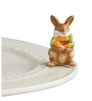 Nora Fleming's New "Funny Bunny" mini shows a bunny with an armload of carrots - and one in his mouth! Adorable for Easter, spring celebrations, and perfect any time of the year for any Nora Fleming serving piece or platter.