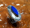 Kee Nez is the Navajo artist of this incredibly beautiful sterling silver and Lapis cabochon ring. This ring measures 2"H x 1 1/4"W domed. Stone measures 1 1/8"H x 3/8"W. Split shank band, Size 7.  All Mudhead Gallery items as you can see are quality made and all one of a kind. Thanks for looking!