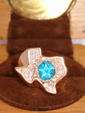 The original copyrighted design in 18kt green gold showing the precision cut Lone Star Blue Topaz.