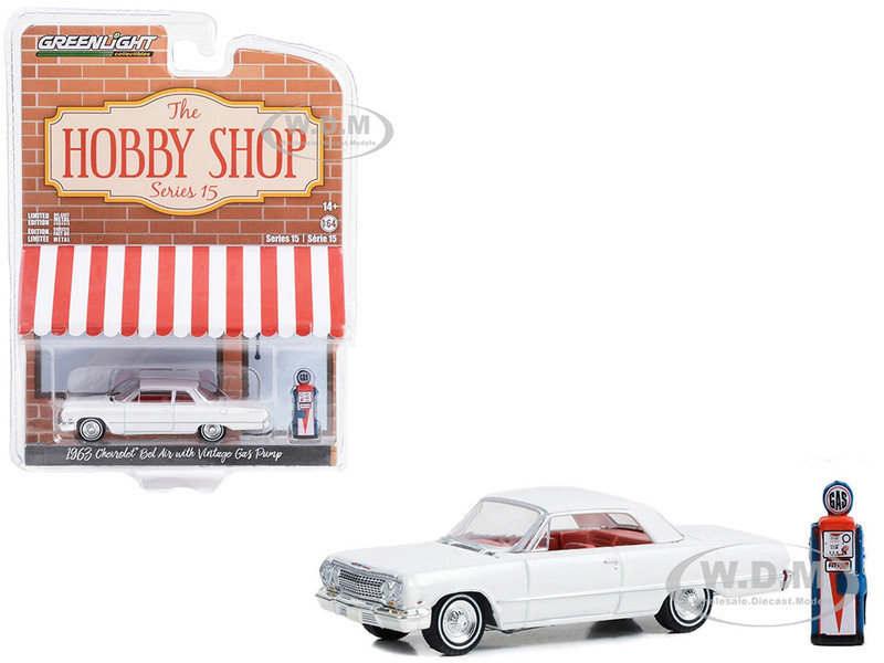1963 Chevrolet Bel Air White with Orange Interior and Vintage Gas Pump The Hobby Shop Series 15 1/64 Diecast Model Car Greenlight 97150A