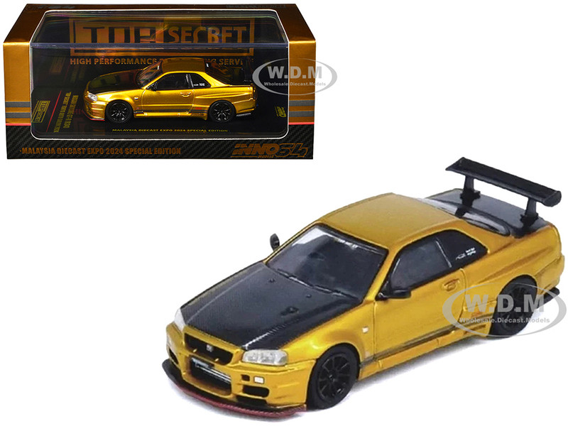 Nissan Skyline GT R R34 Top Secret RHD Right Hand Drive Gold Metallic with Carbon Hood and Trunk Tokyo Auto Salon 2024 Malaysia Diecast Expo 2024 1/64 Diecast Model Car Inno Models IN64-R34TS-MDX24