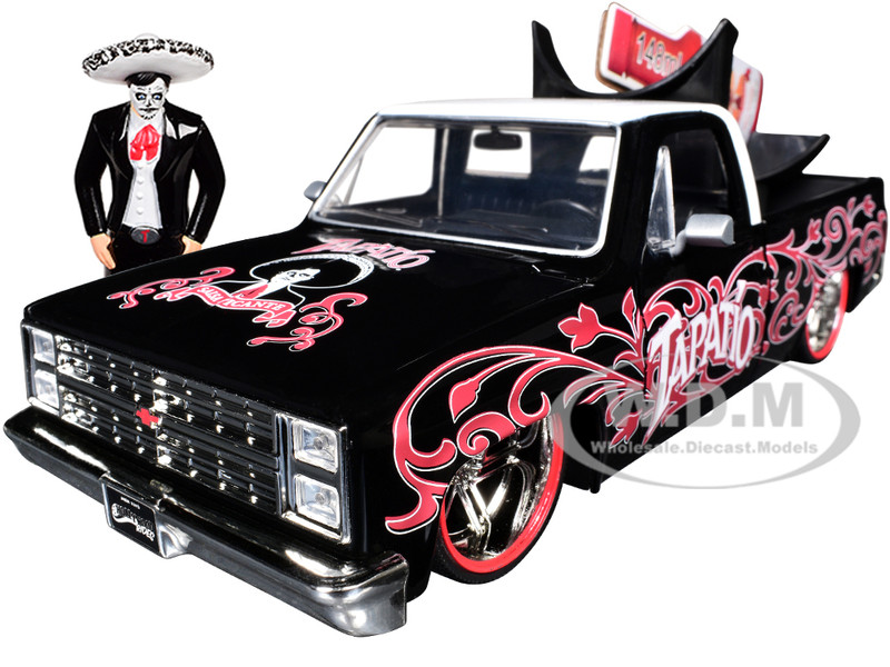 1985 Chevrolet C 10 Pickup Truck Black with White Top and Graphics with Charro Man Diecast Figure Tapatio 1/24 Diecast Model Car Jada 35476