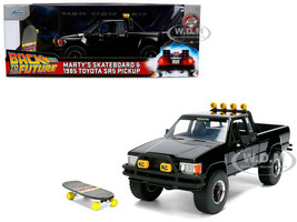 1985 Toyota SR5 Pickup Truck Black with Marty s Skateboard Back to the Future 1985 Movie Hollywood Rides Series 1/24 Diecast Model Car Jada 36479
