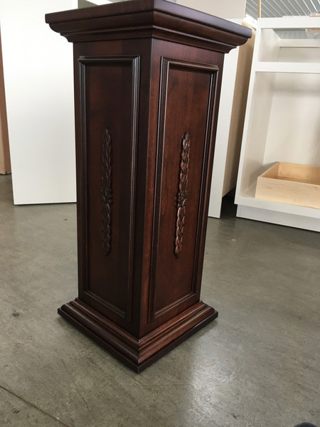 Side view of pedestal featuring a secret compartment
