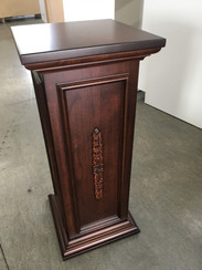 Pedestal featuring a secret compartment