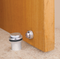 Floor-Mounted Flat Top Magnetic Door Stop with hidden screw mounts (Brass Satin Nickel Finish) mockup on wood door