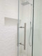 Shower Door 12" Ladder Style Back-to-Back Pull Handle,  3/4" diameter (Brushed Satin Stainless Steel Finish) on glass door