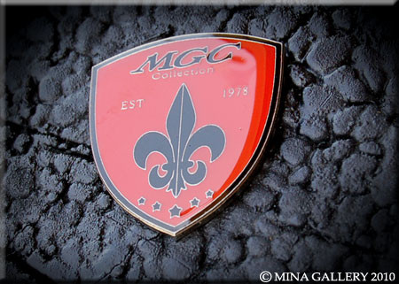 Mina Gallery Collection (MGC) Emblem - Mina Gallery Inc