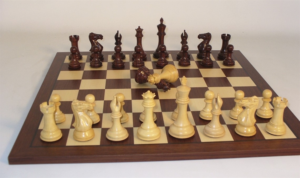 Rosewoood chess pieces on rosewood chess board