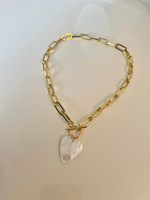Beautiful Mother of Pearl heart pendant, hand crafted in 21kt gold filled elements. Approximately 20" long.