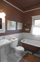 Color in Space Cabin Dwelling Palette in bathroom with beadboard wainscot.