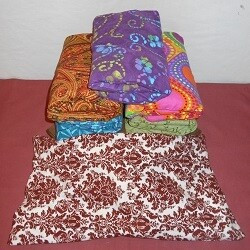 The "pillow" has a wider shape relieves the ache of abdominal and back issues has a "weighted feel" when resting on your chest designed for larger areas covers and warms the top of feet great for warming the bed helps keep your PETS bed warm. 18" x 7"