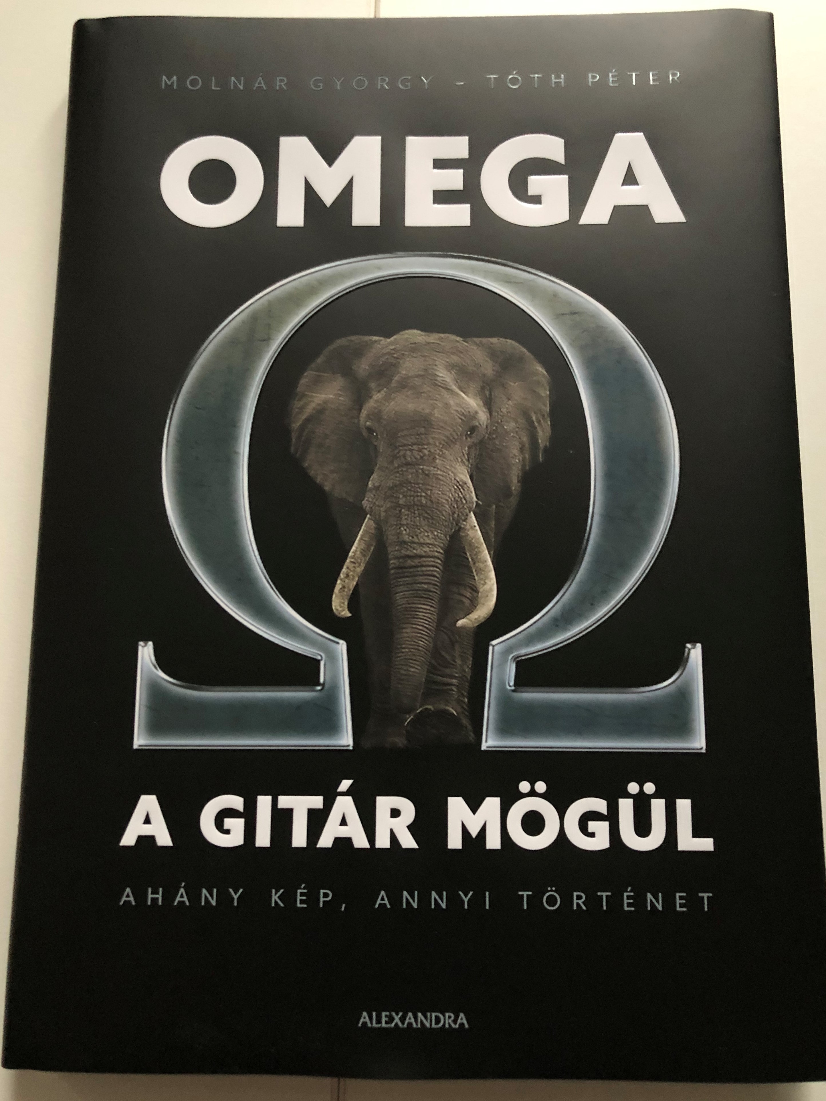 Omega a gitár mögül by Molnár György - Tóth Péter  Ahány kép, annyi  történet  Omega band behind the scenes book  Alexandra kiadó  Hardcover  - Bible in My Language