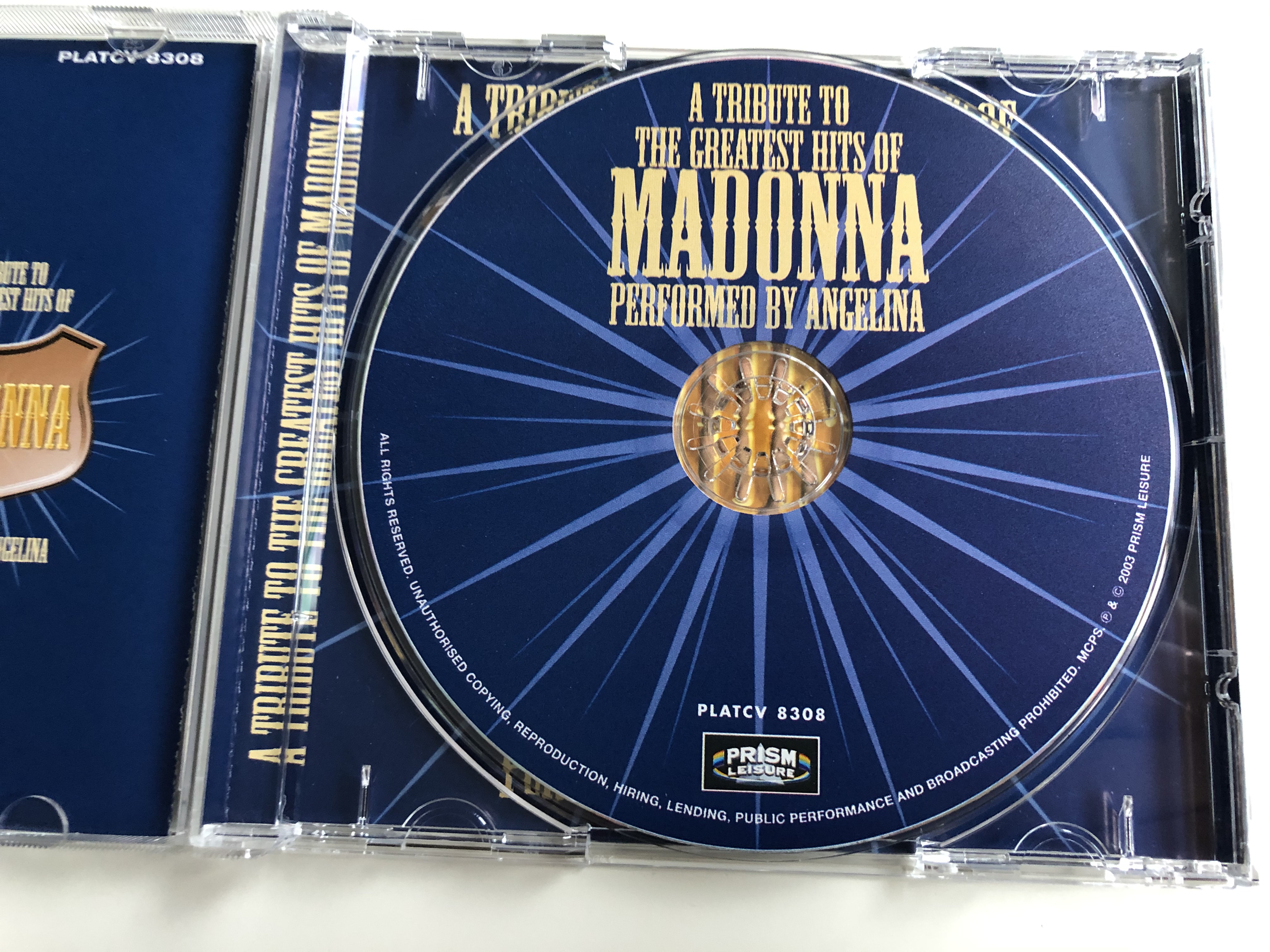 a-tribute-to-the-greatest-hits-of-madonna-performed-by-angelina-featuring-die-another-day-american-life-la-isla-bonita-vogue-holiday-like-a-virgin-prism-lesiure-audio-cd-2003-platcv-830-3-.jpg