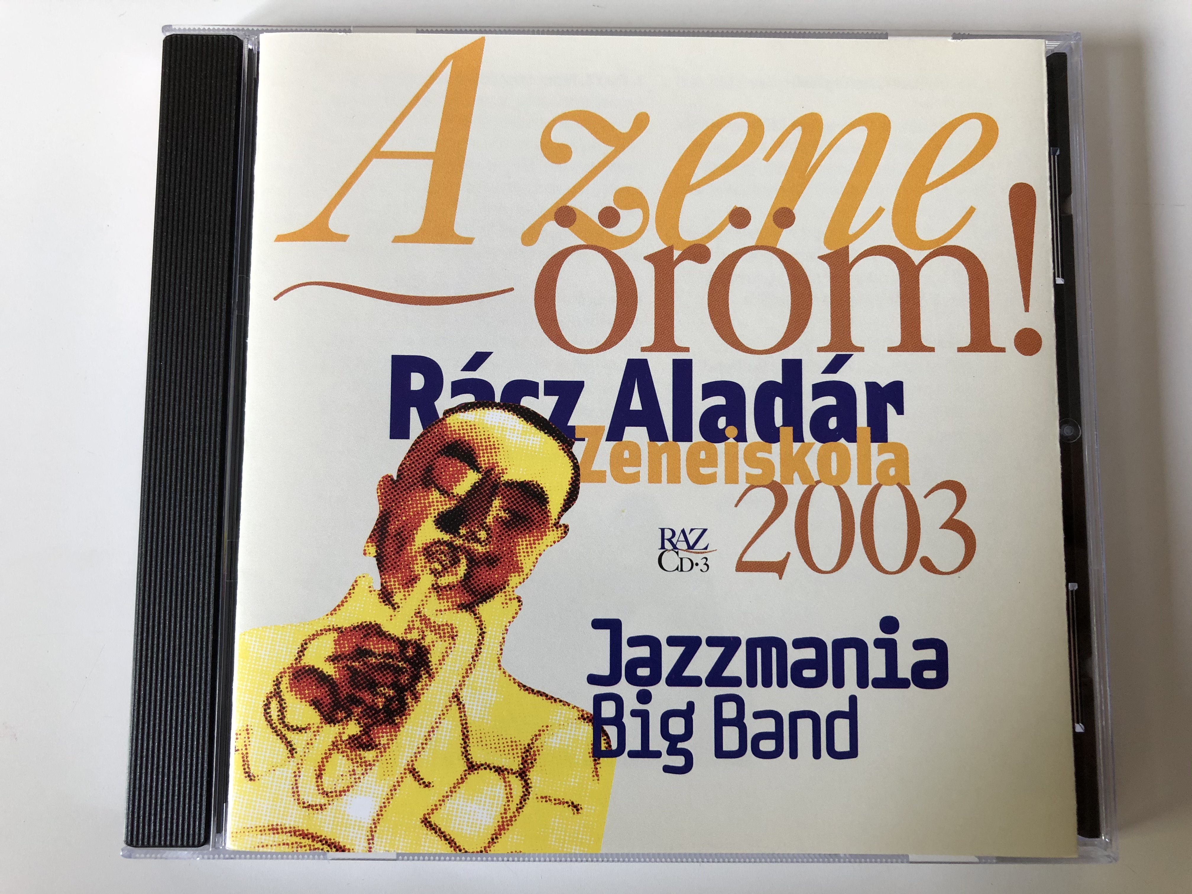 a-zene-orom-3.-rasz-aladar-zeneiskola-2003-jazzmania-big-band-mc-cd-produkcio-audio-cd-2003-hcd-187-cd3-1-.jpg