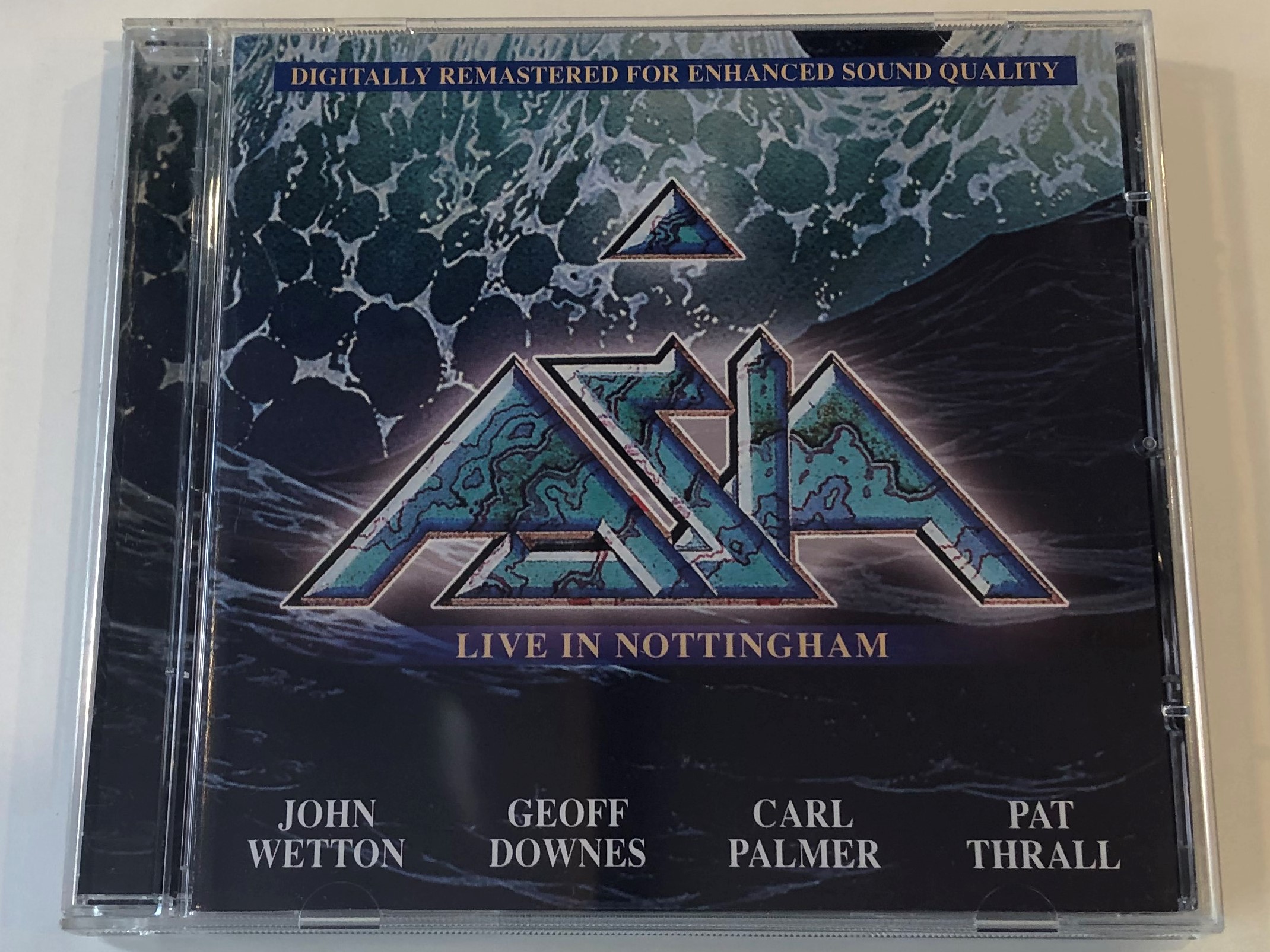 asia-live-in-nottingham-digitally-remastered-for-enhanced-sound-quality-john-wetton-geoff-downes-carl-palmer-pat-thrall-classic-rock-productions-audio-cd-2002-823880010460-1-.jpg
