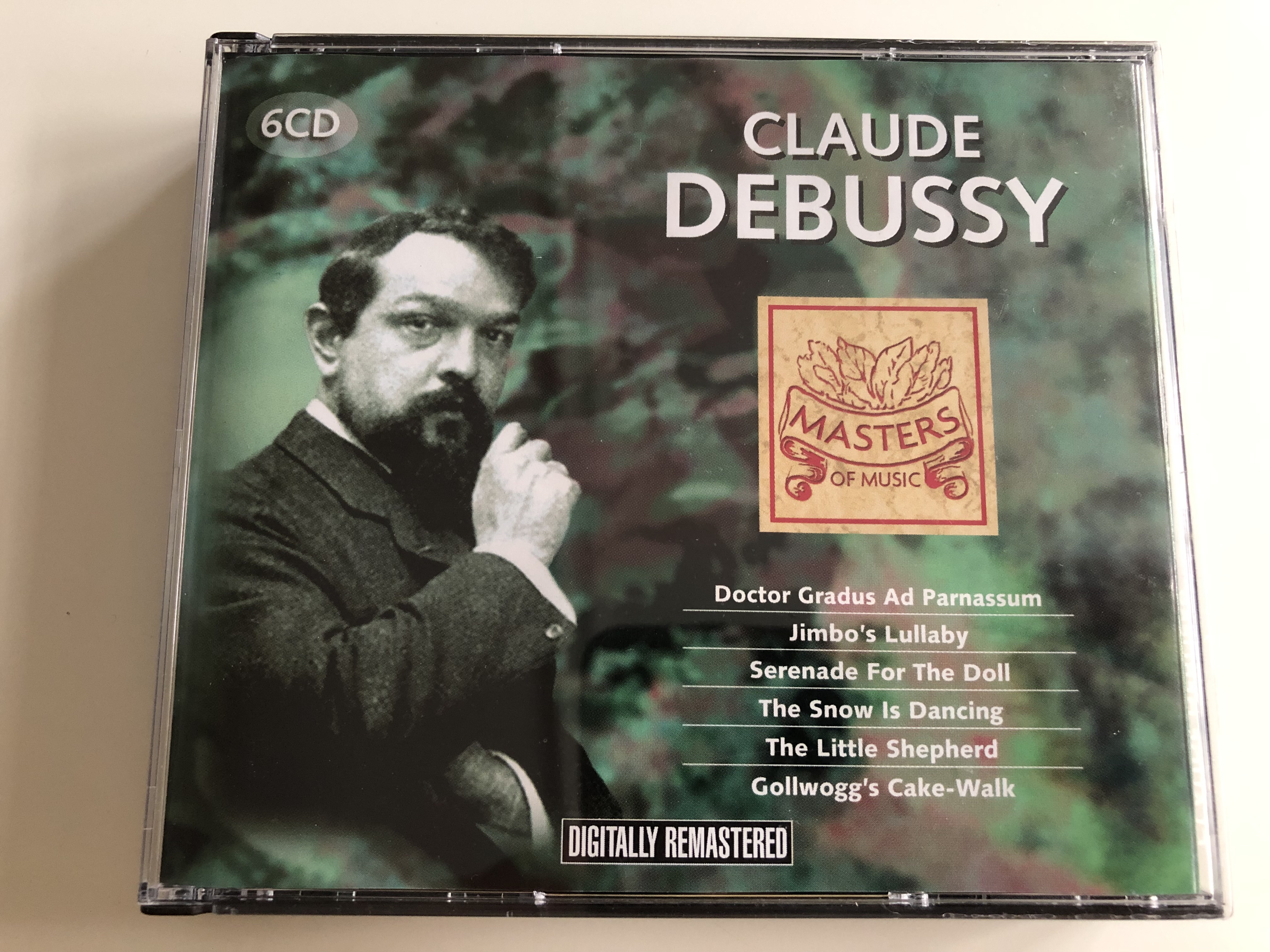 claude-debussy-doctor-gradus-ad-parnassum-jimbo-s-lullaby-serenade-for-the-doll-the-snow-is-dancing-the-little-shepherd-gollwogg-s-cake-walk-6-cd-masters-of-music-mom-611-1-.jpg