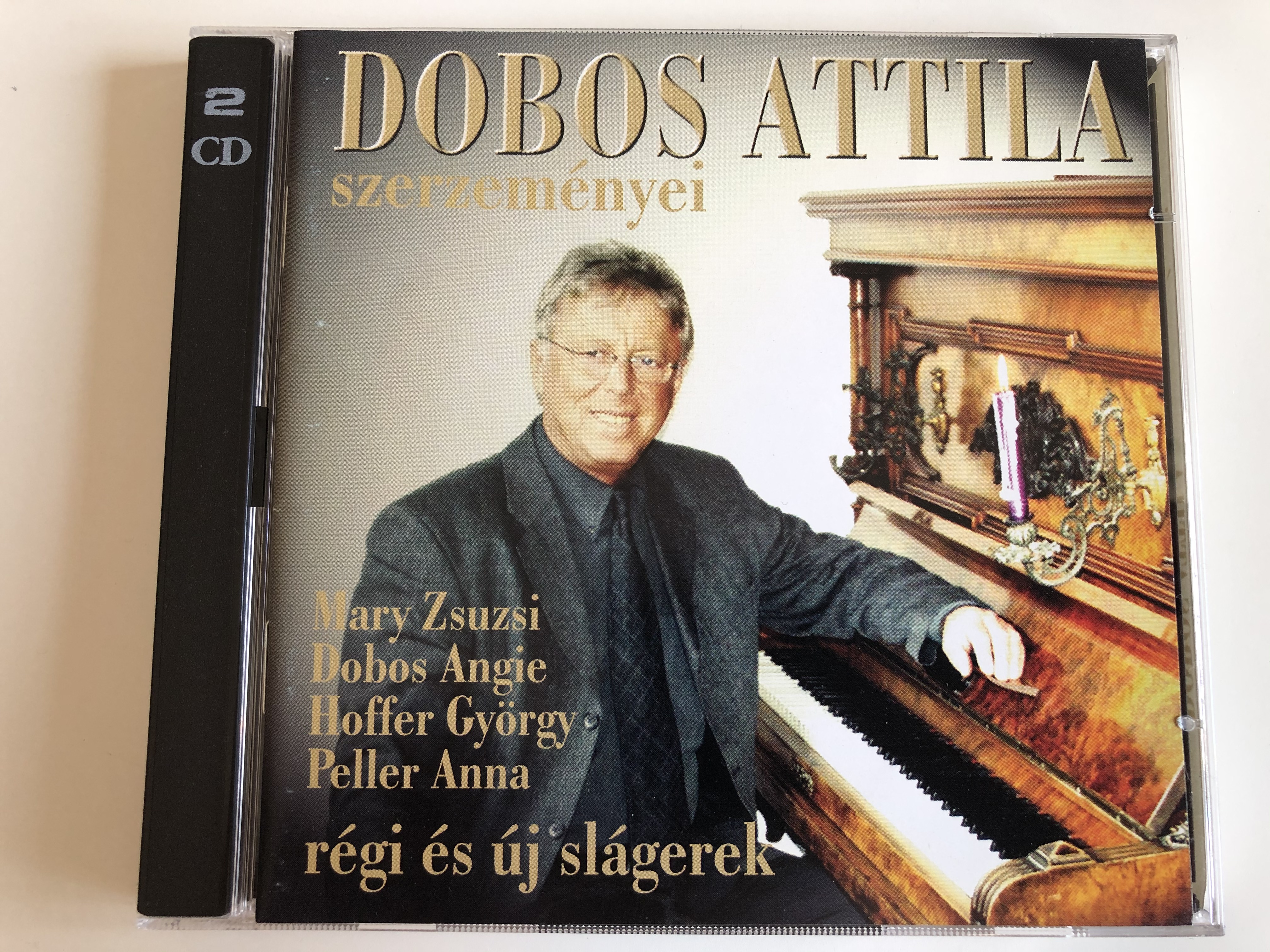 dobos-attila-szerzem-nyei-mary-zsuzsi-dobos-angie-hoffer-gyorgy-peller-anna-regi-es-uj-slagerek-musica-hungarica-ltd.-2x-audio-cd-2001-5999880437011-1-.jpg