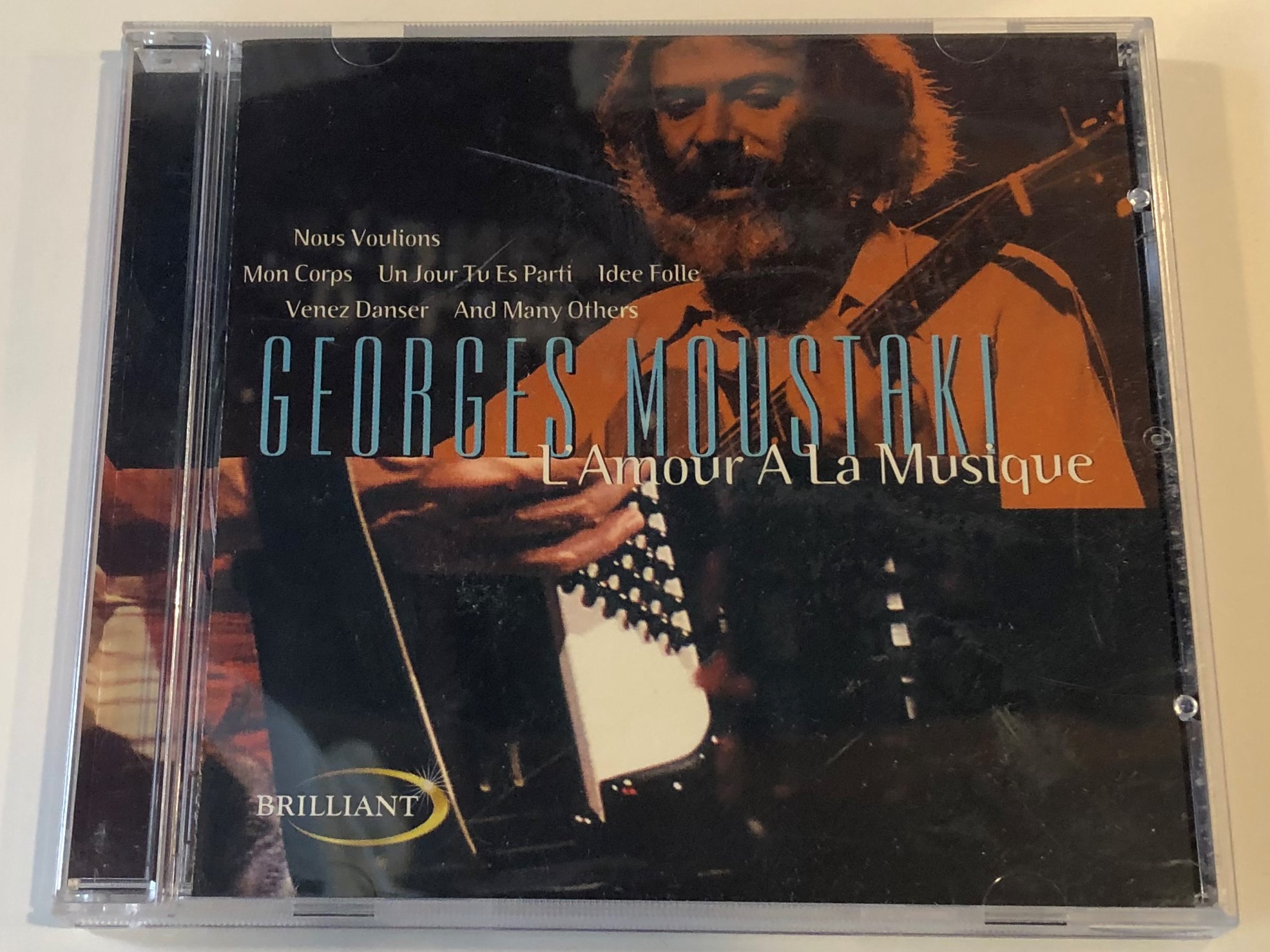 georges-moustaki-l-amour-a-la-musique-nous-voulons-mon-corps-un-jour-tu-es-parti-idee-folie-venez-danser-and-many-orhers-brilliant-audio-cd-1999-bt-33034-1-.jpg