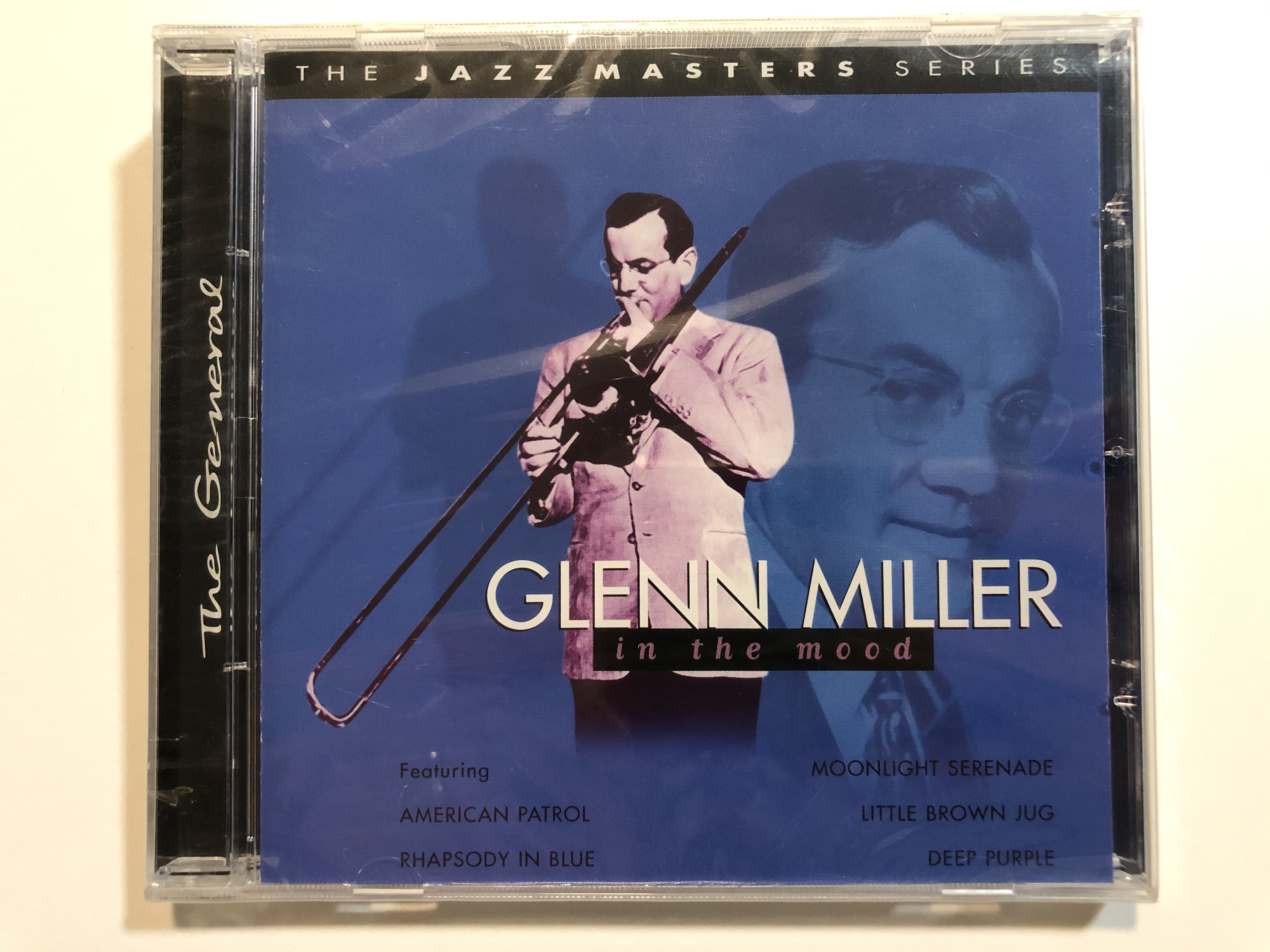 glenn-miller-in-the-mood-featuring-american-patrol-rhapsody-in-blue-monnlight-serenade-little-brown-jug-deep-purple-the-jazz-masters-series-prism-leisure-audio-cd-2002-platcd-775-1-.jpg