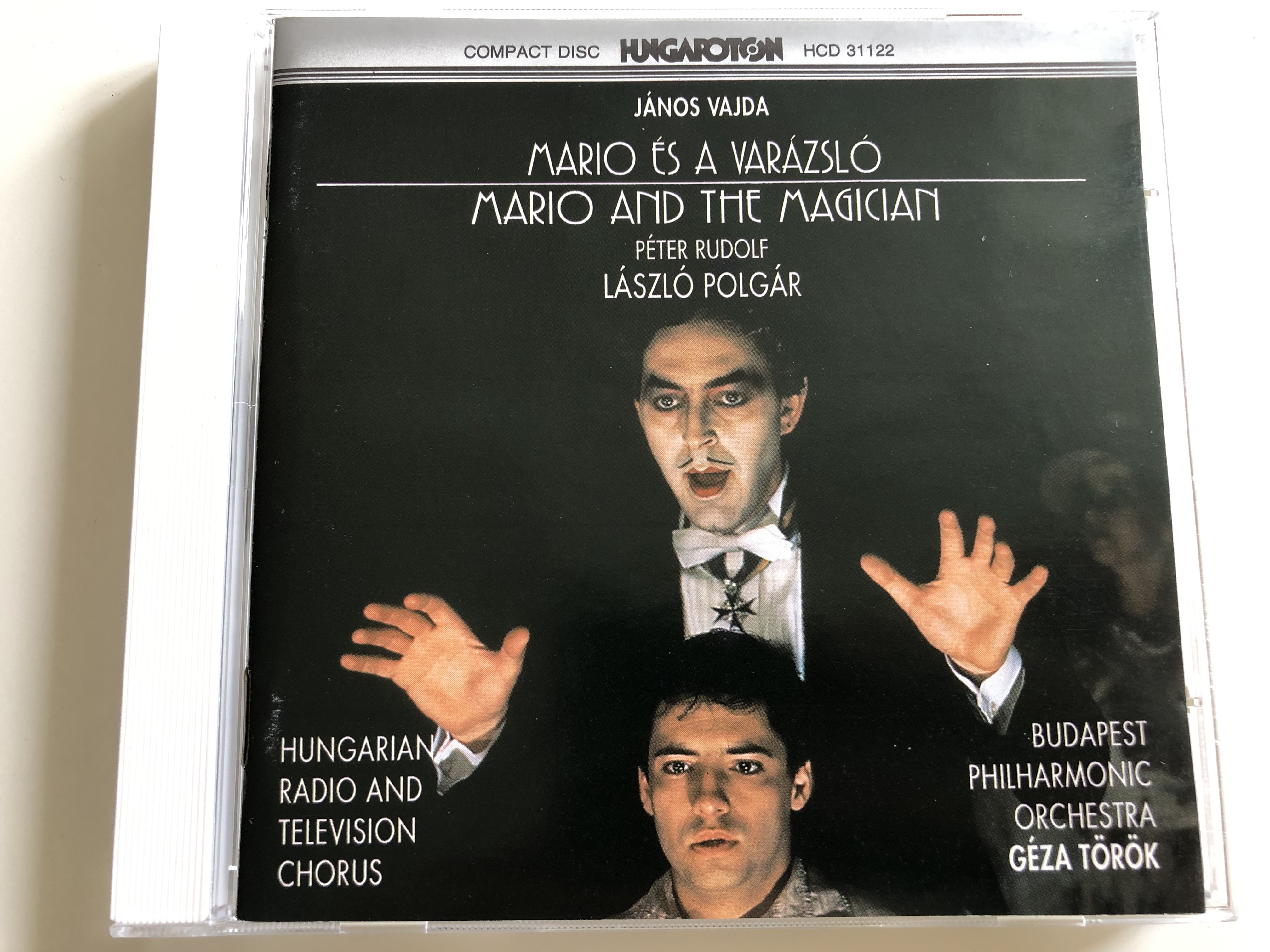 j-nos-vajda-m-ri-s-a-var-zsl-mario-and-the-magician-opera-in-one-act-audio-cd-1990-hungarian-radio-and-television-chorus-budapest-philharmonic-orchestra-conducted-by-g-za-t-r-k-hungaroton-hcd-31122-1-.jpg j-nos-vajda-m-ri-s-a-var-zsl-mario-and-the-magician-opera-in-one-act-audio-cd-1990-hungarian-radio-and-television-chorus-budapest-philharmonic-orchestra-conducted-by-g-za-t-r-k-hungaroton-hcd-31122-1-.jpg