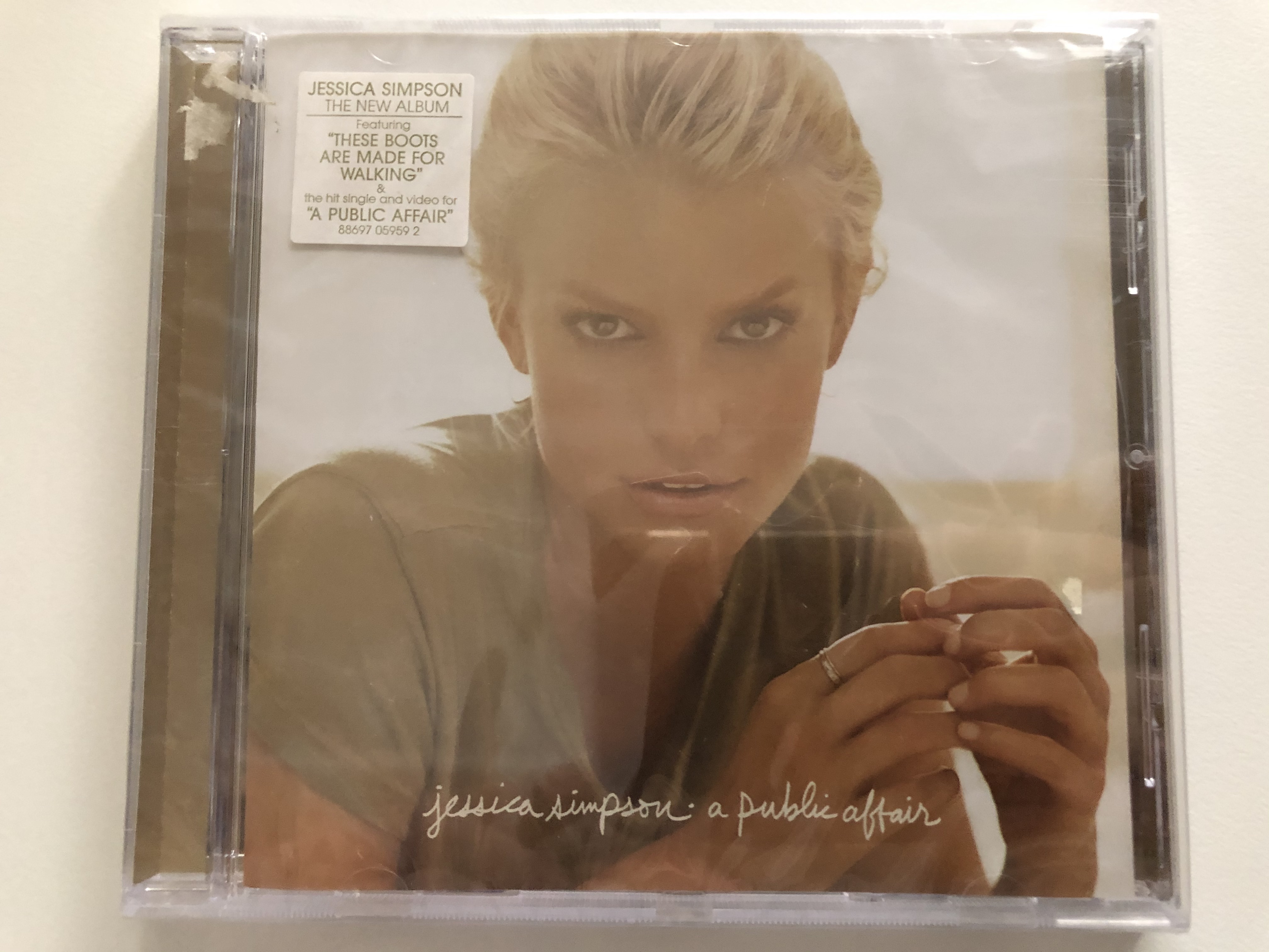 jessica-simpson-a-public-affair-the-new-album-featuring-these-boots-are-made-for-walking-the-hit-single-and-video-for-a-public-affair-sony-bmg-music-entertainment-audio-cd-2007-1-.jpg
