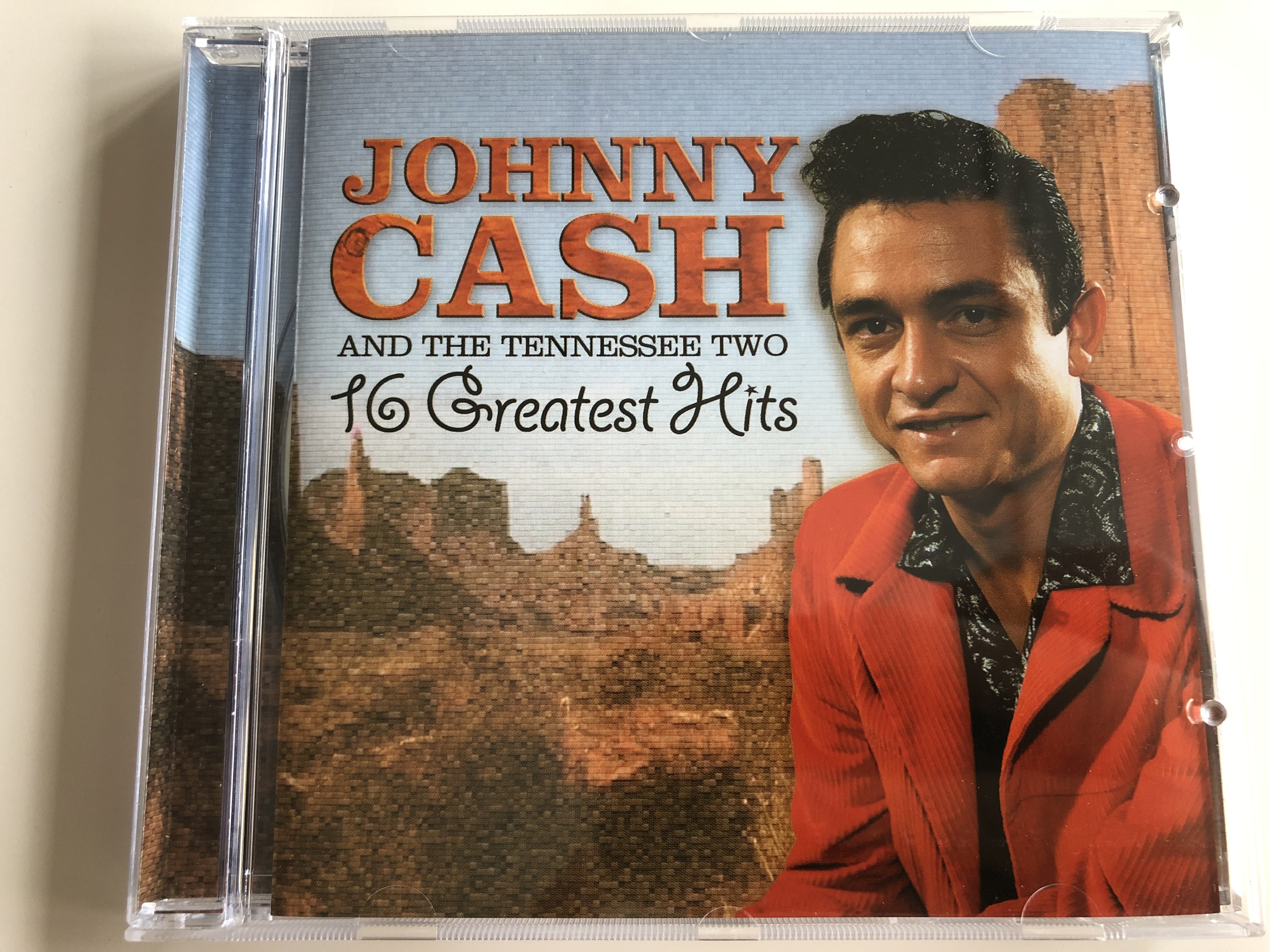 johnny-cash-and-the-tennessee-two-16-greatest-hits-ballad-of-a-teenage-queen-i-walk-the-line-folsom-prison-blues-luther-s-boogie-audio-cd-2005-10575-2-1-.jpg