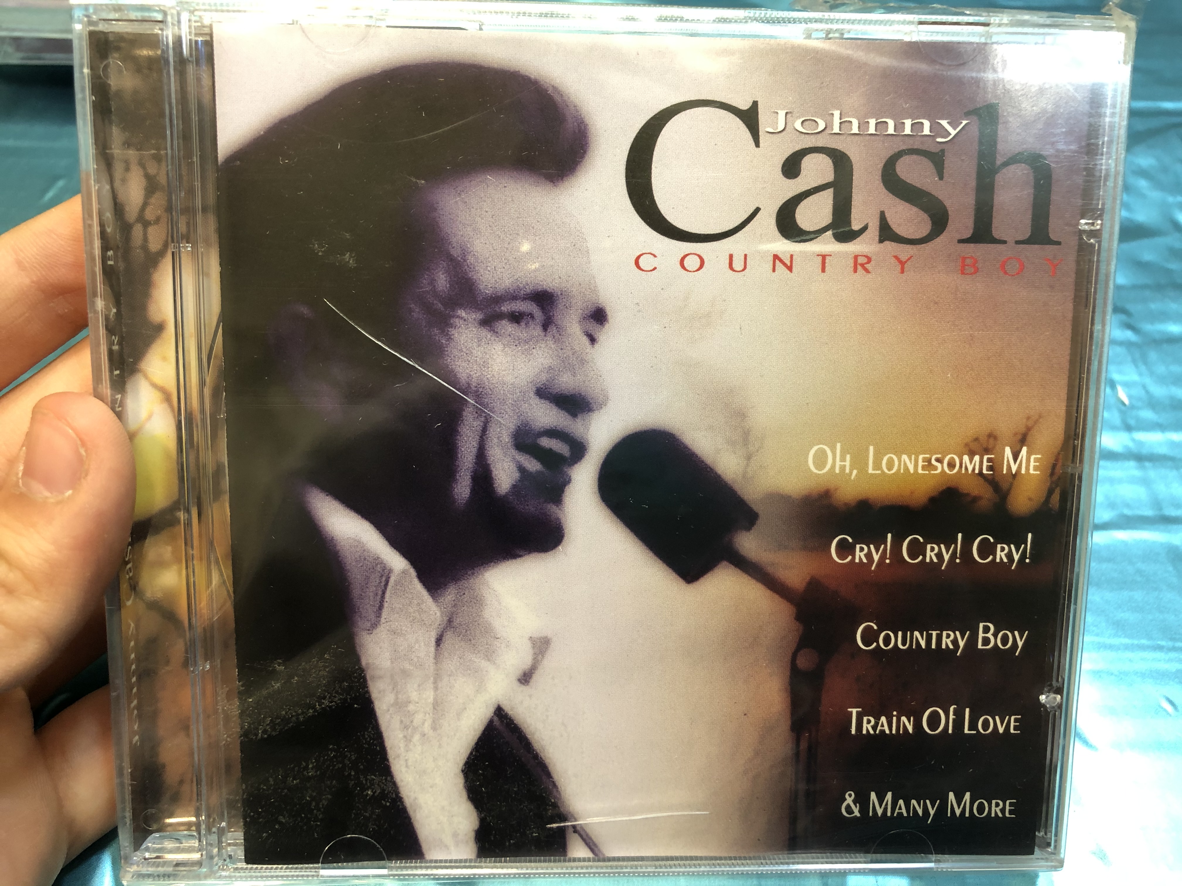 johnny-cash-country-boy-oh-lonesome-me-cry-cry-cry-country-boy-train-of-love-many-more-musicbank-limited-audio-cd-2000-apwcd1111-1-.jpg