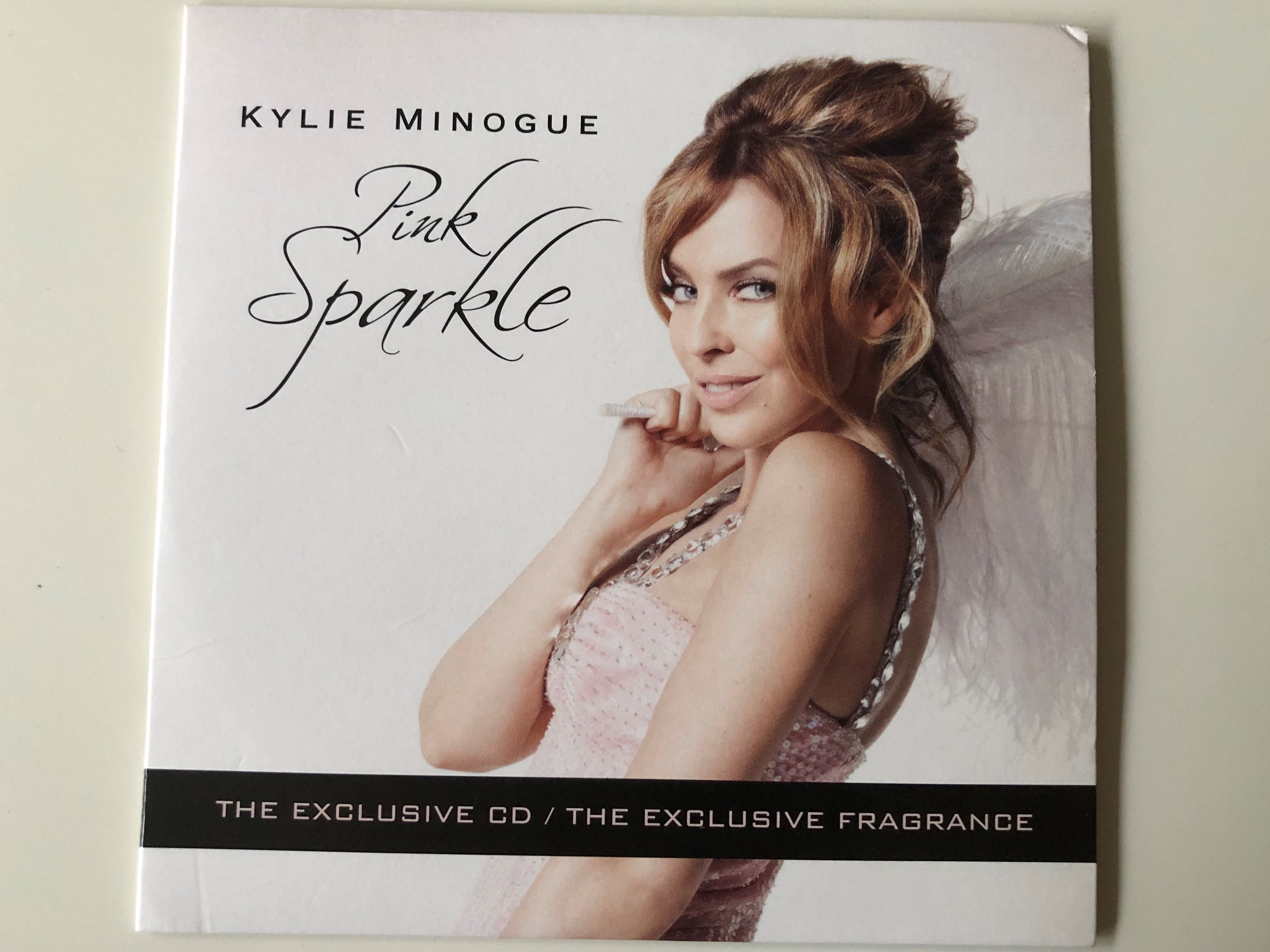 kylie-minogue-pink-sparkle-the-exclusive-cd-the-exclusive-fragrance-parlophone-audio-cd-2010-3607345564722-1-.jpg