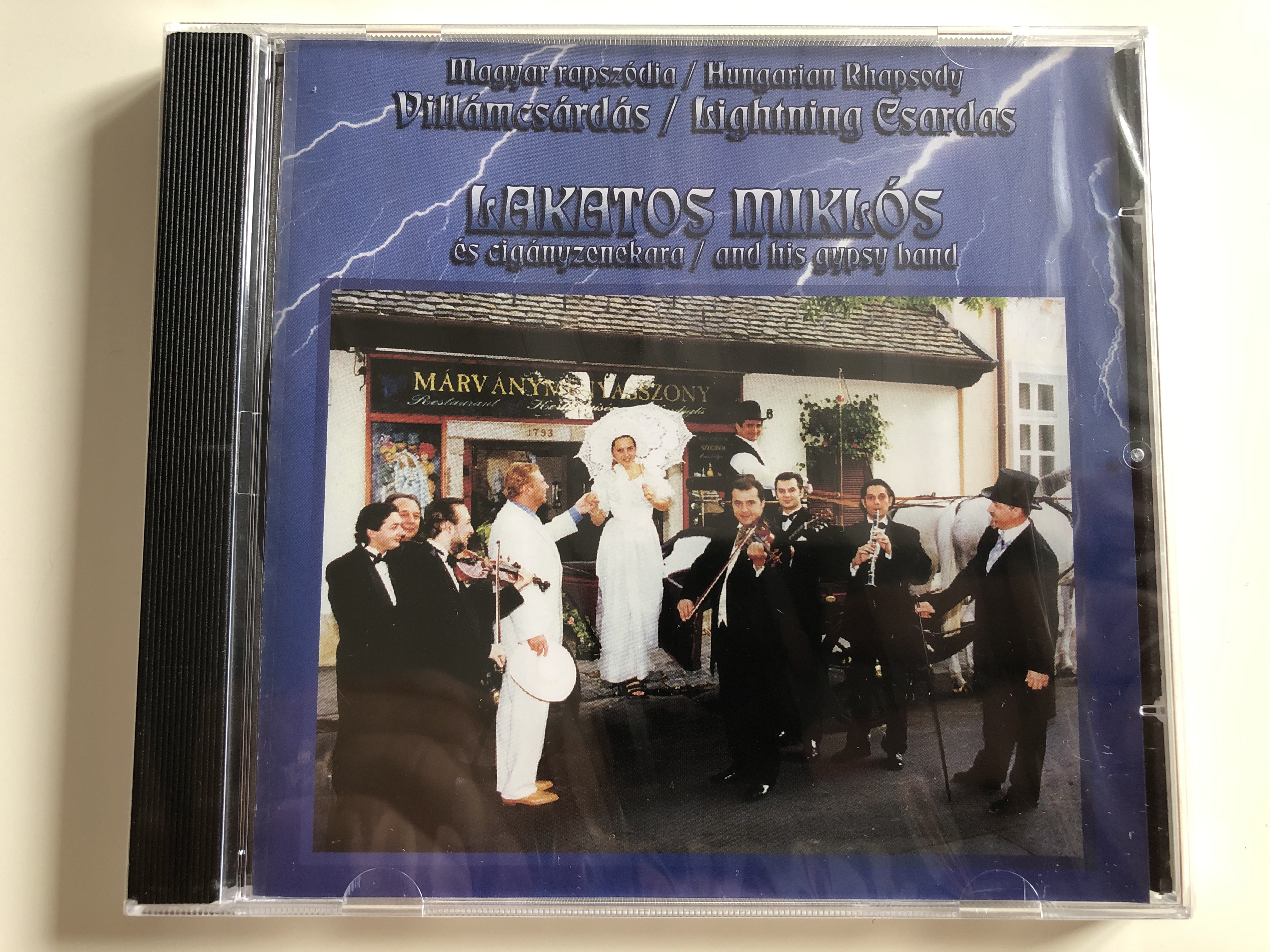 magyar-rapsz-dia-hungarian-rhapsody-vill-mcs-rd-s-lightning-csardas-lakatos-mikl-s-s-cig-nyzenekara-and-his-gypsy-band-musicdome-kft-audio-cd-5998175162768-1-.jpg