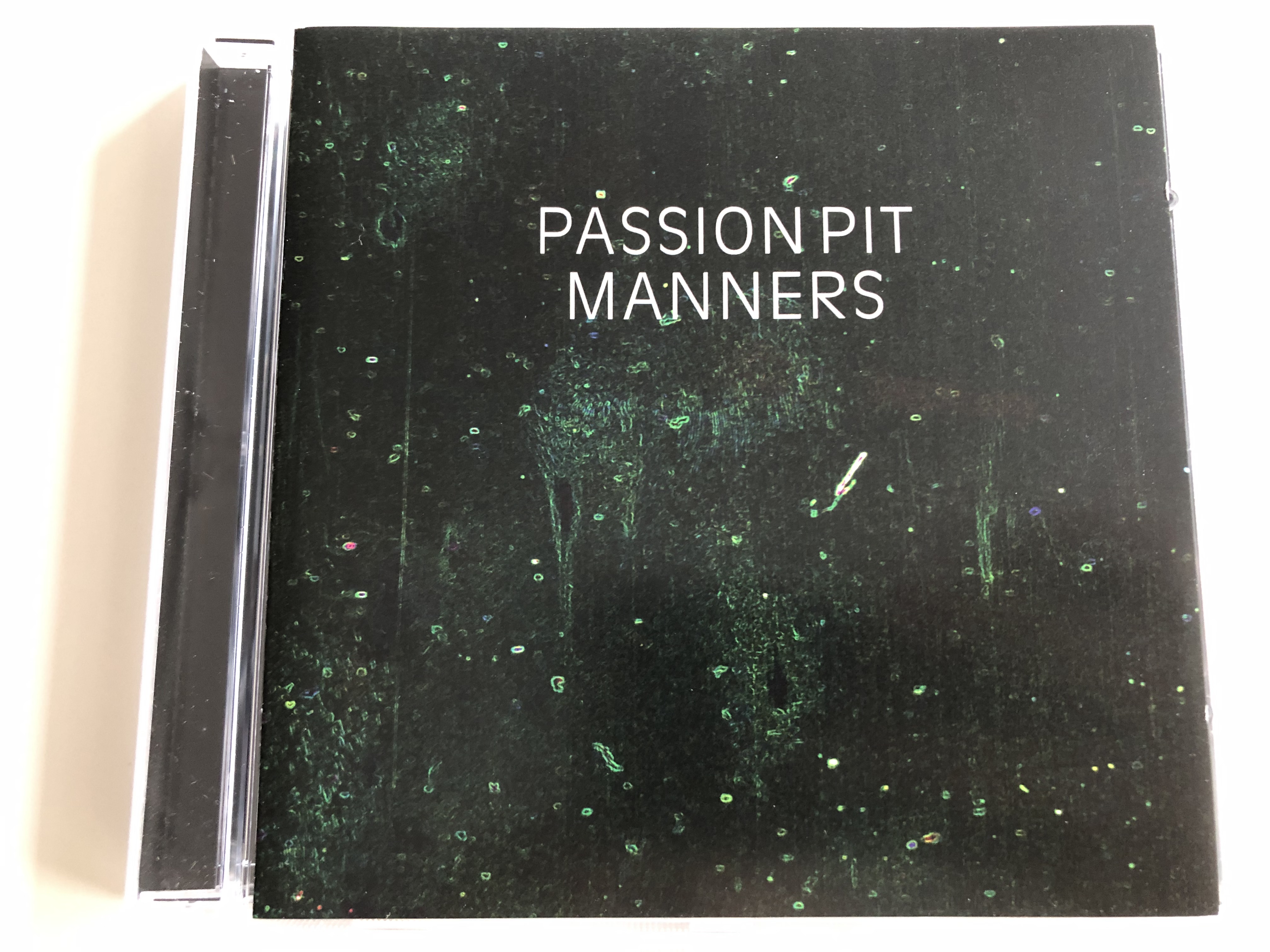 passion-pit-manners-make-light-little-secrets-moth-s-wings-the-reeling-eyes-as-candles-swimming-in-the-flood-to-kingdom-come-audio-cd-2009-columbia-records-1-.jpg