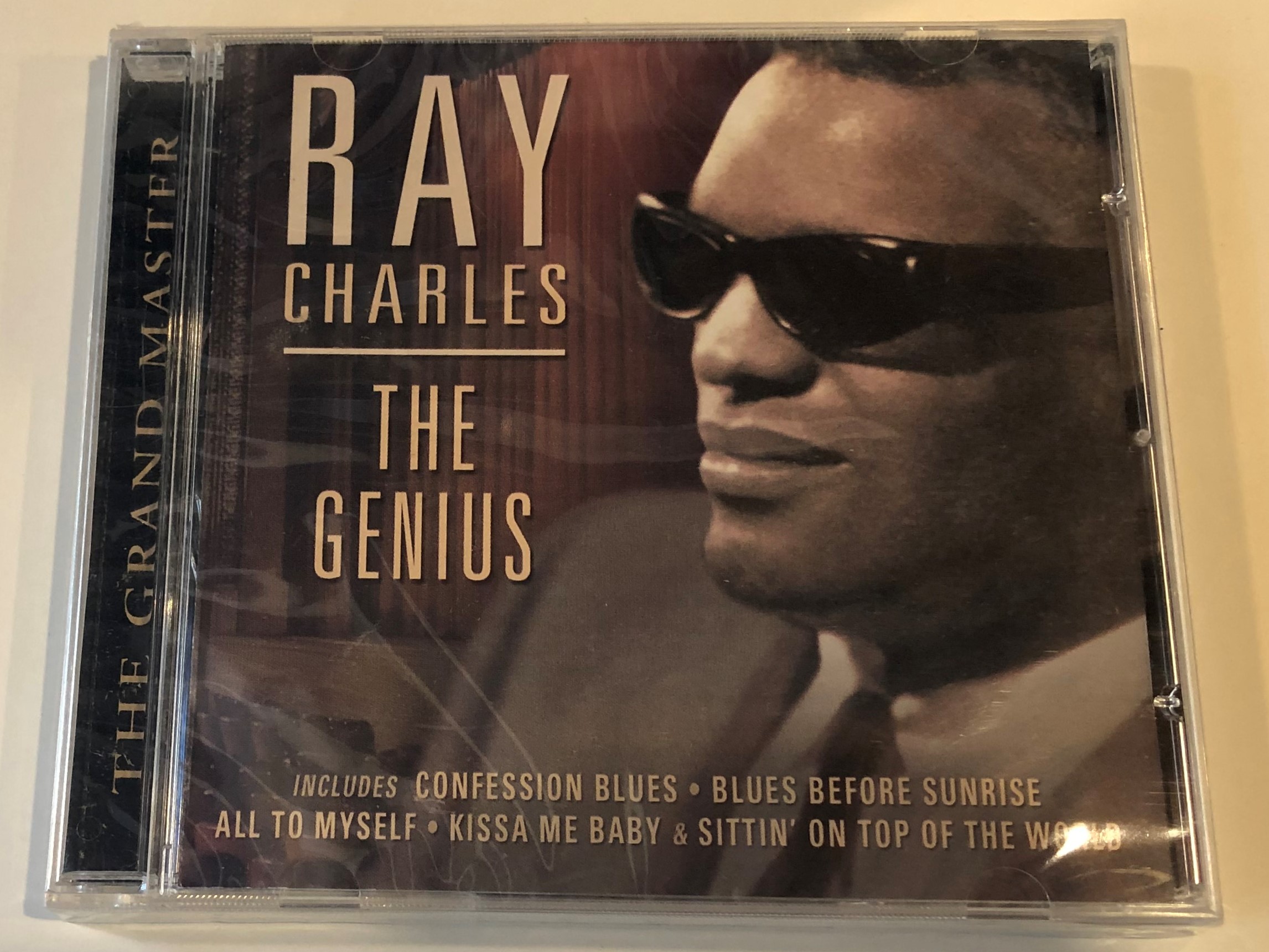 ray-charles-the-genius-the-grand-master-includes-confession-blues-blues-before-sunrise-all-to-myself-kissa-me-baby-sittin-on-top-of-the-world-prism-leisure-audio-cd-2003-platcd-927-1-.jpg