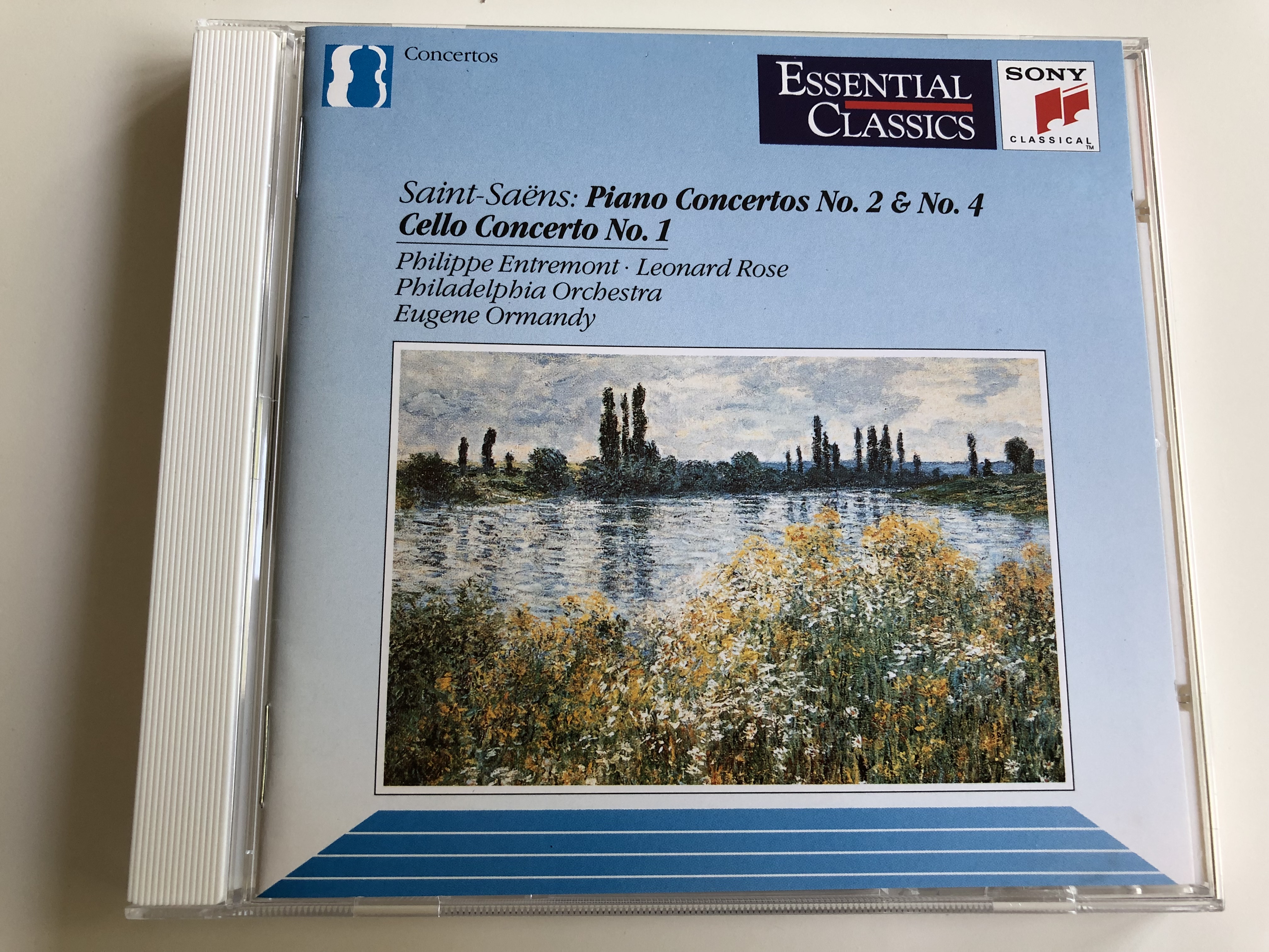 saint-saens-piano-concertos-no.-2-no.-4-cello-concerto-no.1-philippe-entremont-leonard-rose-philadelphia-orchestra-conducted-by-eugene-ormandy-audio-cd-1992-essential-classics-1-.jpg