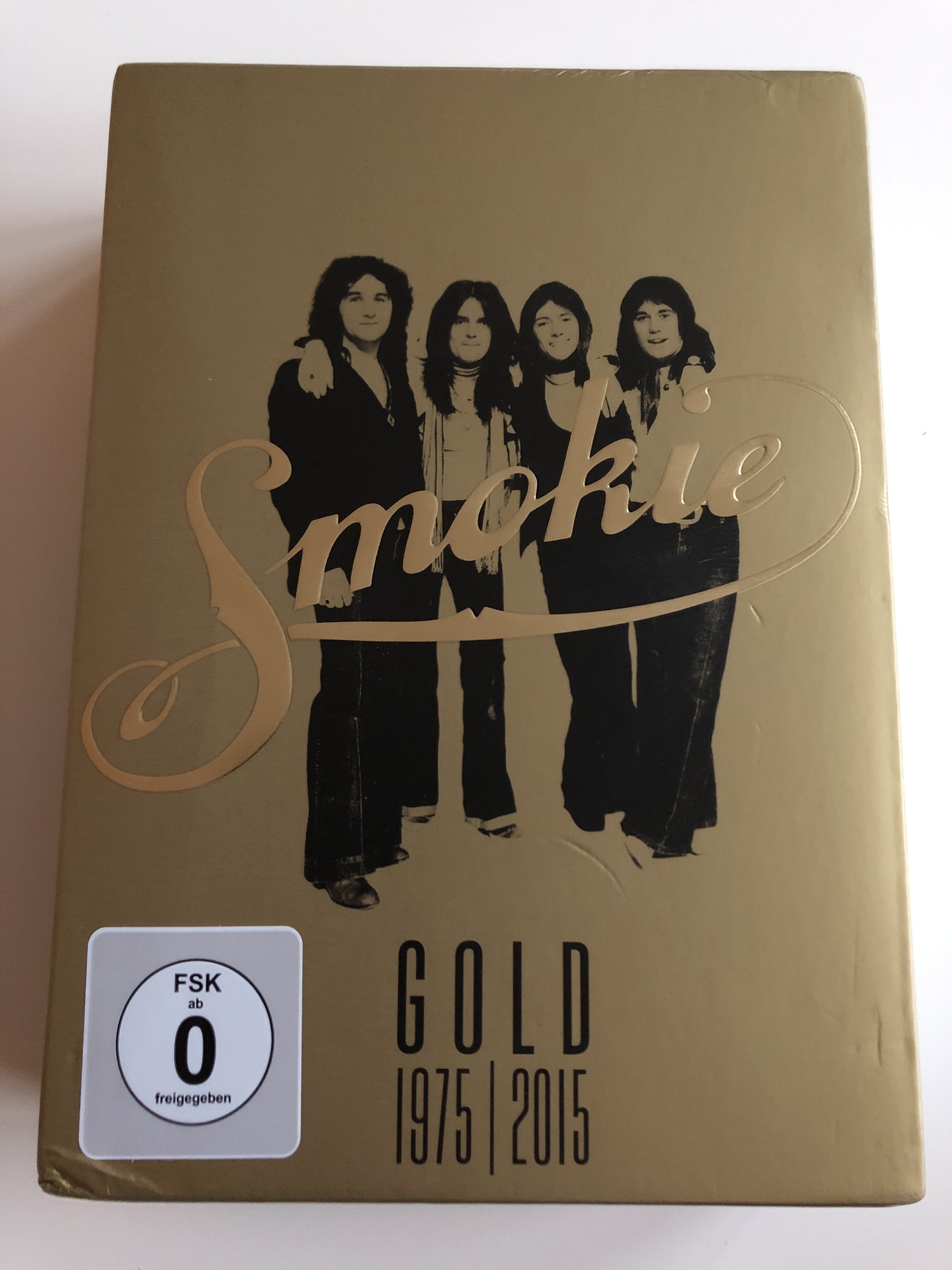 smokie-gold-1975-2015-dvd-40th-anniversary-edition-the-definitive-smokie-anthology-all-the-greatest-hits-tv-appearances-from-around-the-world-documentaries-and-interviews-extensive-bonus-features-sony-music-3-dvd-1-.jpg