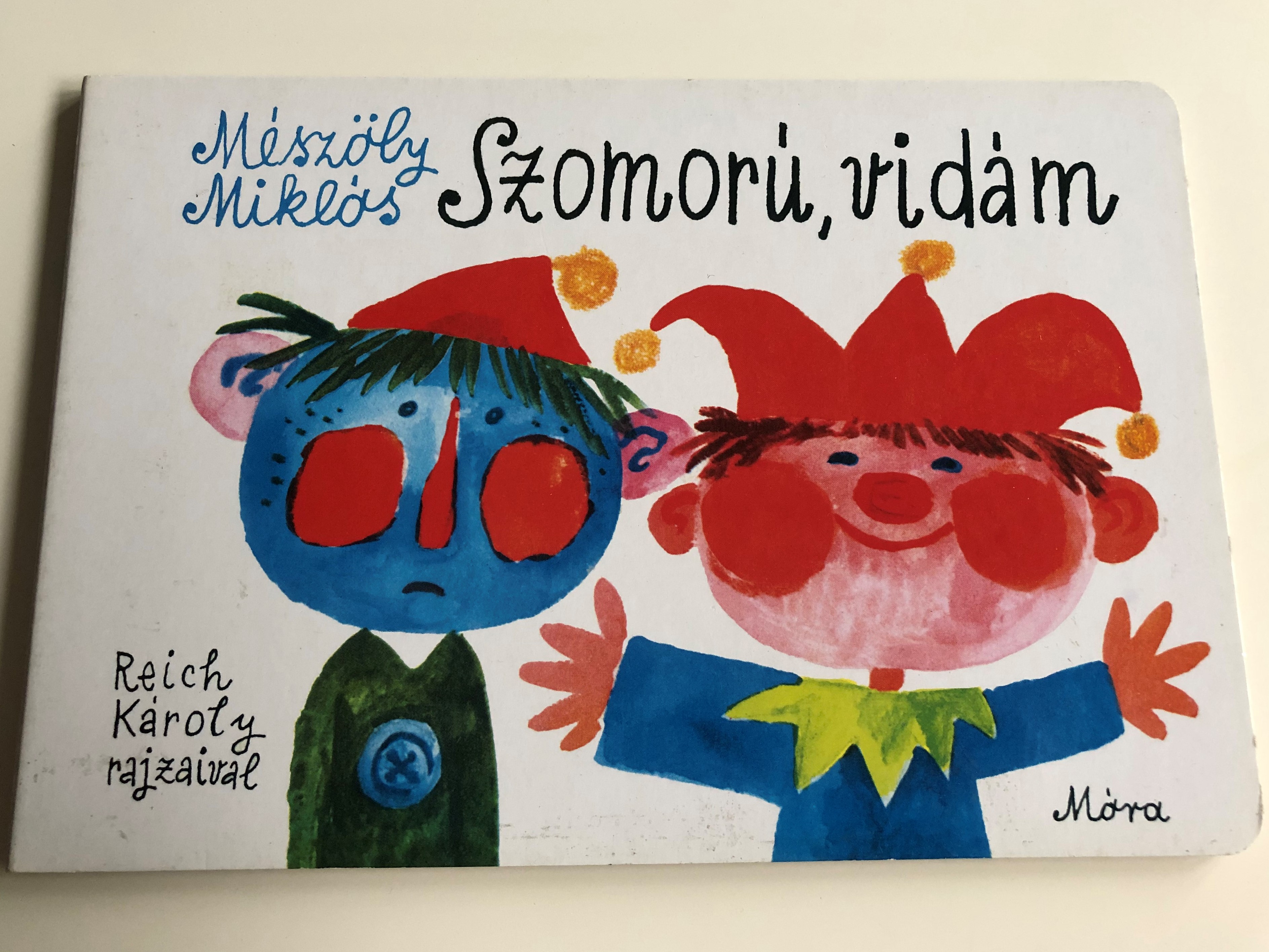 szomor-vid-m-by-m-sz-ly-mikl-s-reich-k-roly-rajzaival-m-ra-sad-happy-2nd-edition-board-book-for-children-about-happy-and-sad-things-m-ra-2010-1-.jpg