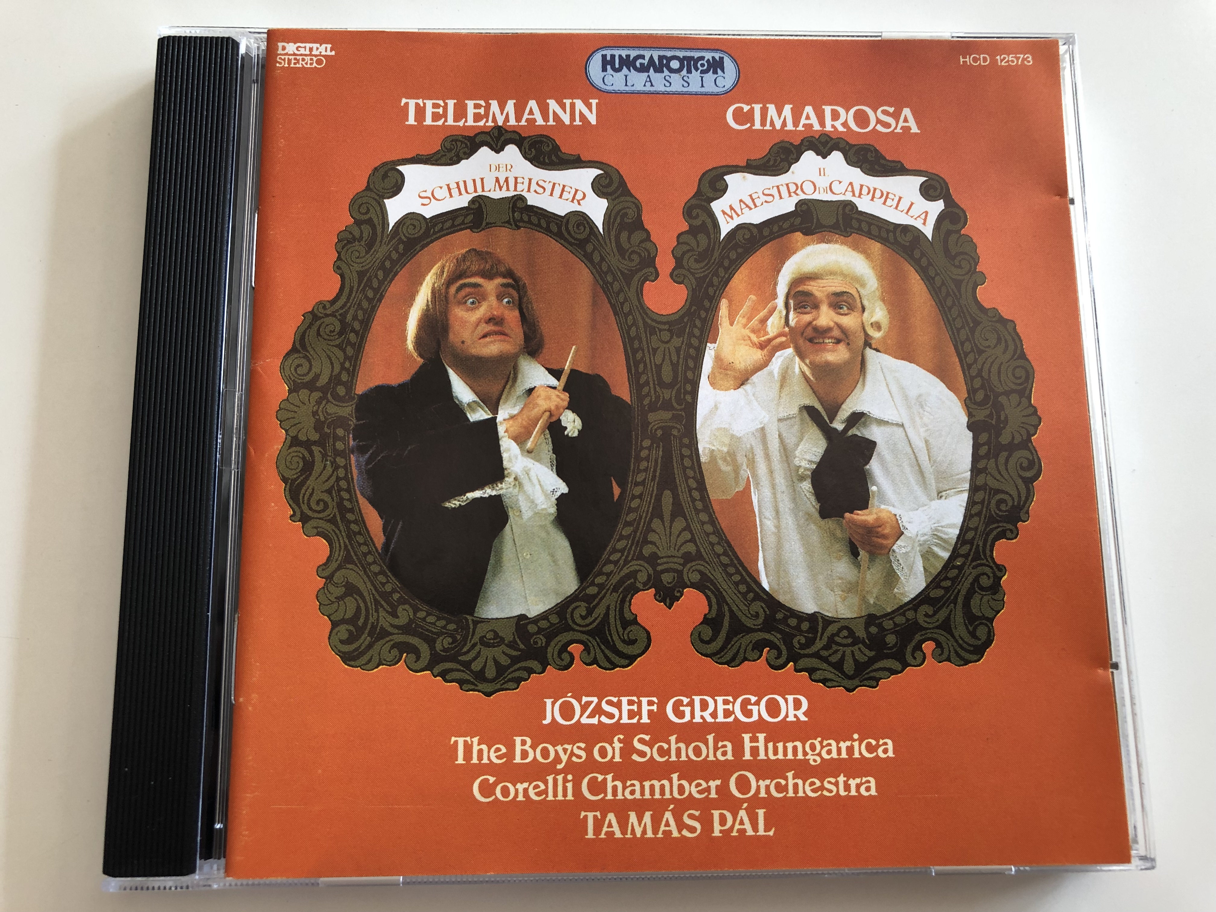 telemann-der-schulmeister-cimarosa-il-maestro-di-cappella-j-zsef-gregor-the-boys-of-schola-hungarica-corelli-chamber-orchestra-tam-s-p-l-hcd-12573-hungaroton-audio-cd-1994-5991811257323-.jpg