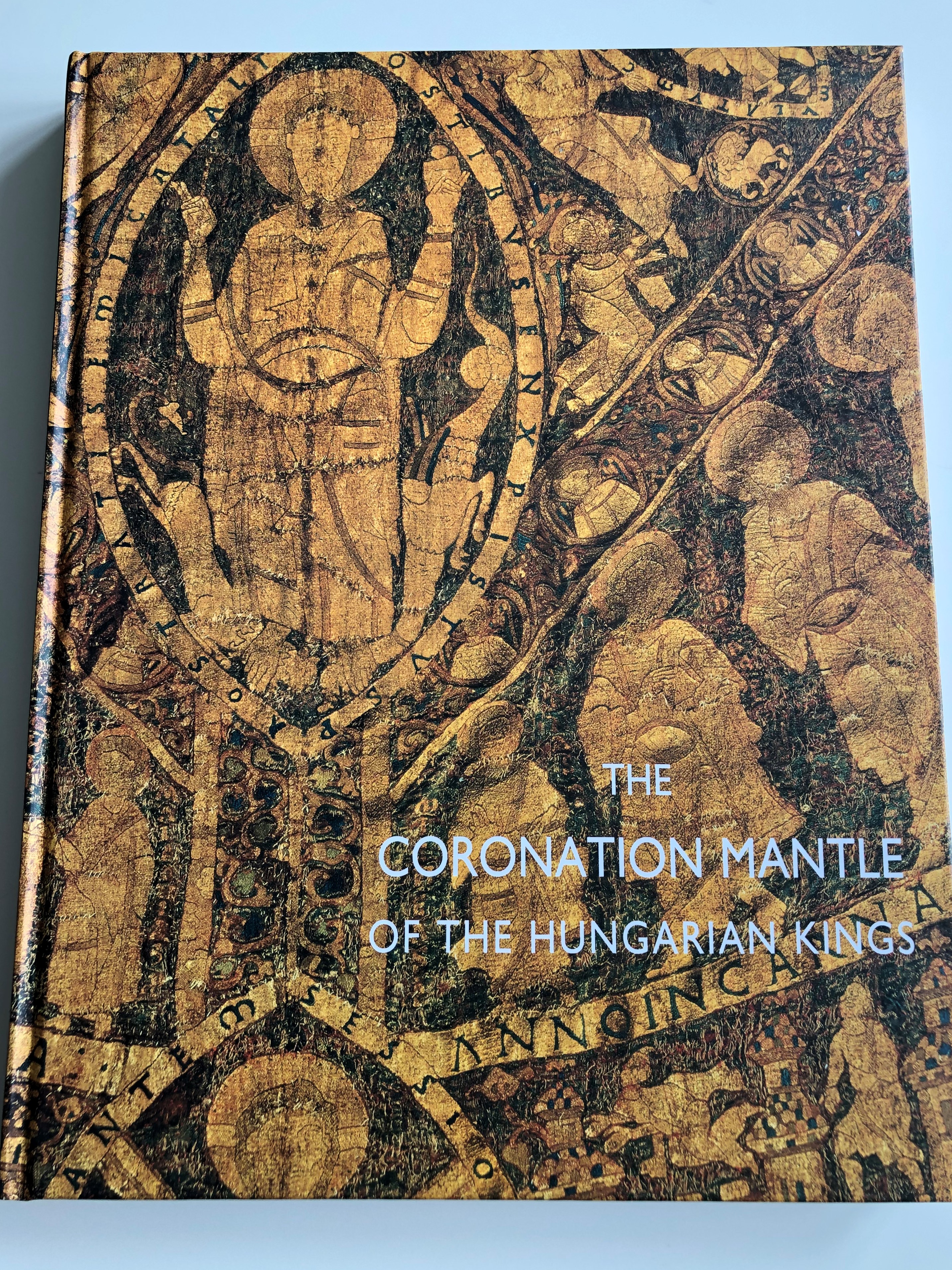 the-coronation-mantle-of-the-hungarian-kings-a-magyar-kir-lyok-koron-z-pal-stja-e.-nagy-katalin-j-r-m-rta-lovag-zsuzsa-marosi-ern-sipos-enik-hungarian-national-museum-studies-illustrations-and-commentaries-hardcover-1-.jpg