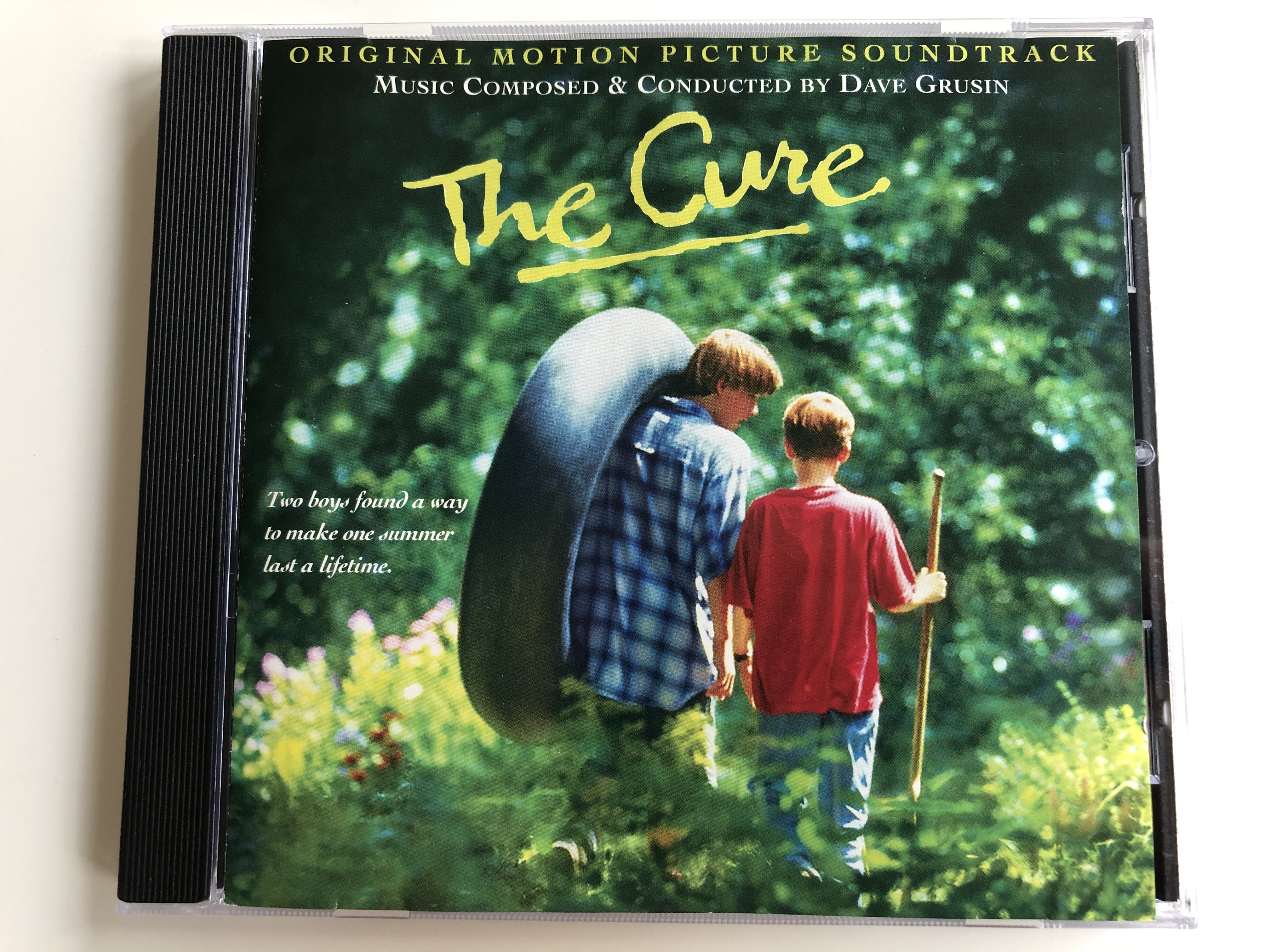 the-cure-original-motion-picture-soundtrack-music-composed-conducted-by-dave-grusin-two-boys-found-way-to-make-one-summer-lost-a-lifetime-grp-audio-cd-1995-grp-98282-1-.jpg