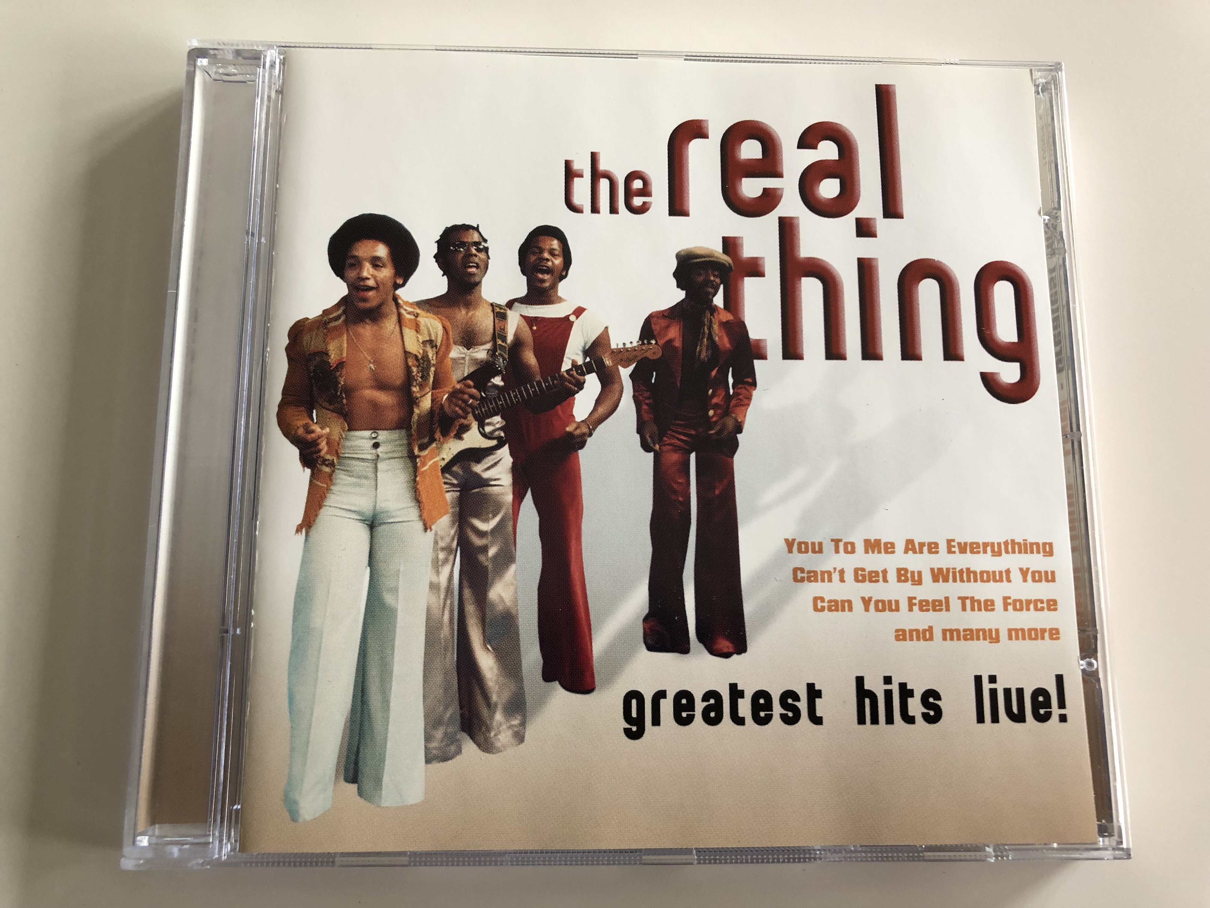 the-real-thing-greatest-hits-live-you-to-me-are-everything-can-t-get-by-without-you-can-you-feel-the-force-and-many-more-a-play-collection-audio-cd-2005-10584-2-1-.jpg