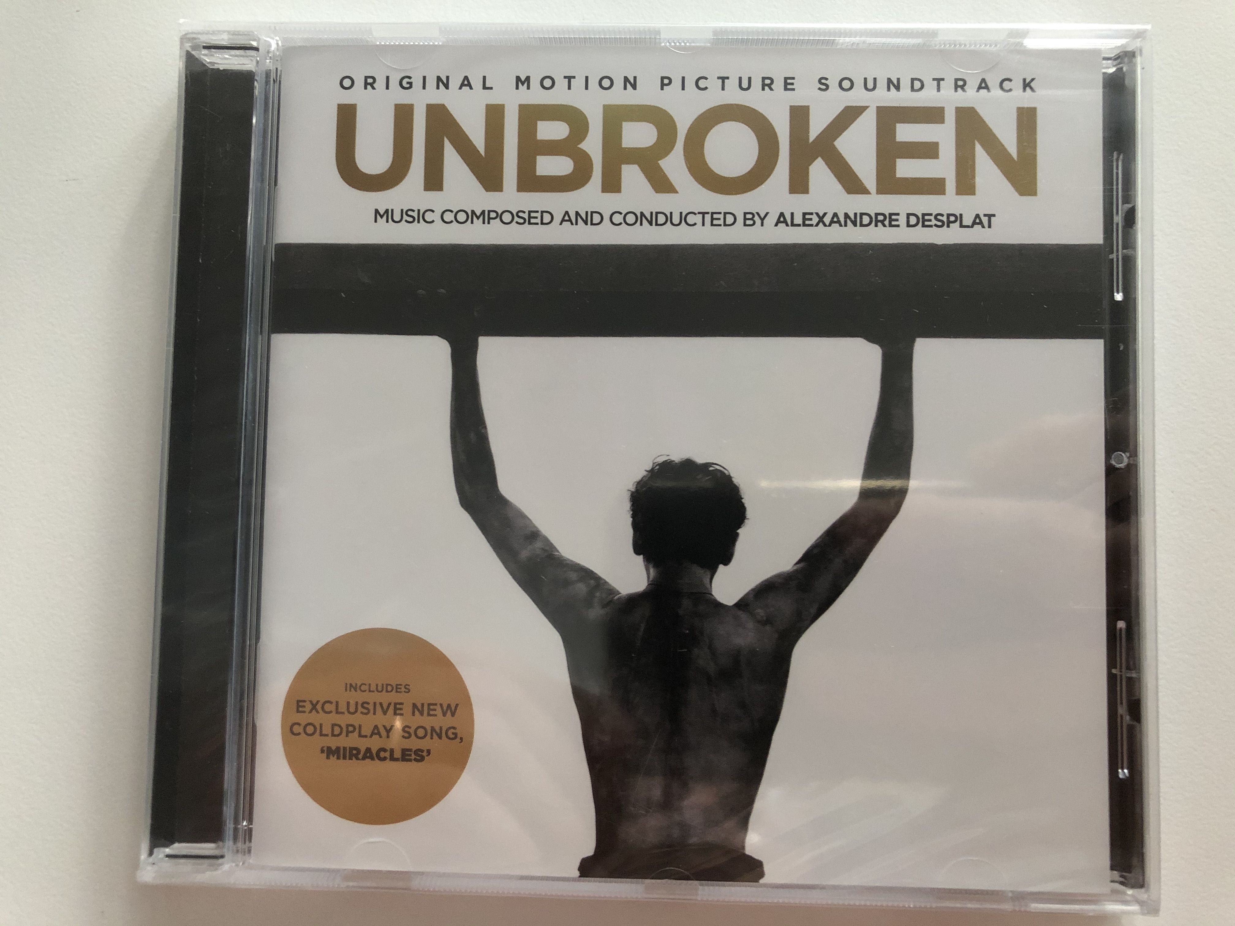 unbroken-original-motion-picture-soundtrack-music-composed-and-conducted-by-alexandre-desplat-includes-exclusive-new-coldplay-song-miracles-parlophone-audio-cd-2014-825646173341-1-.jpg