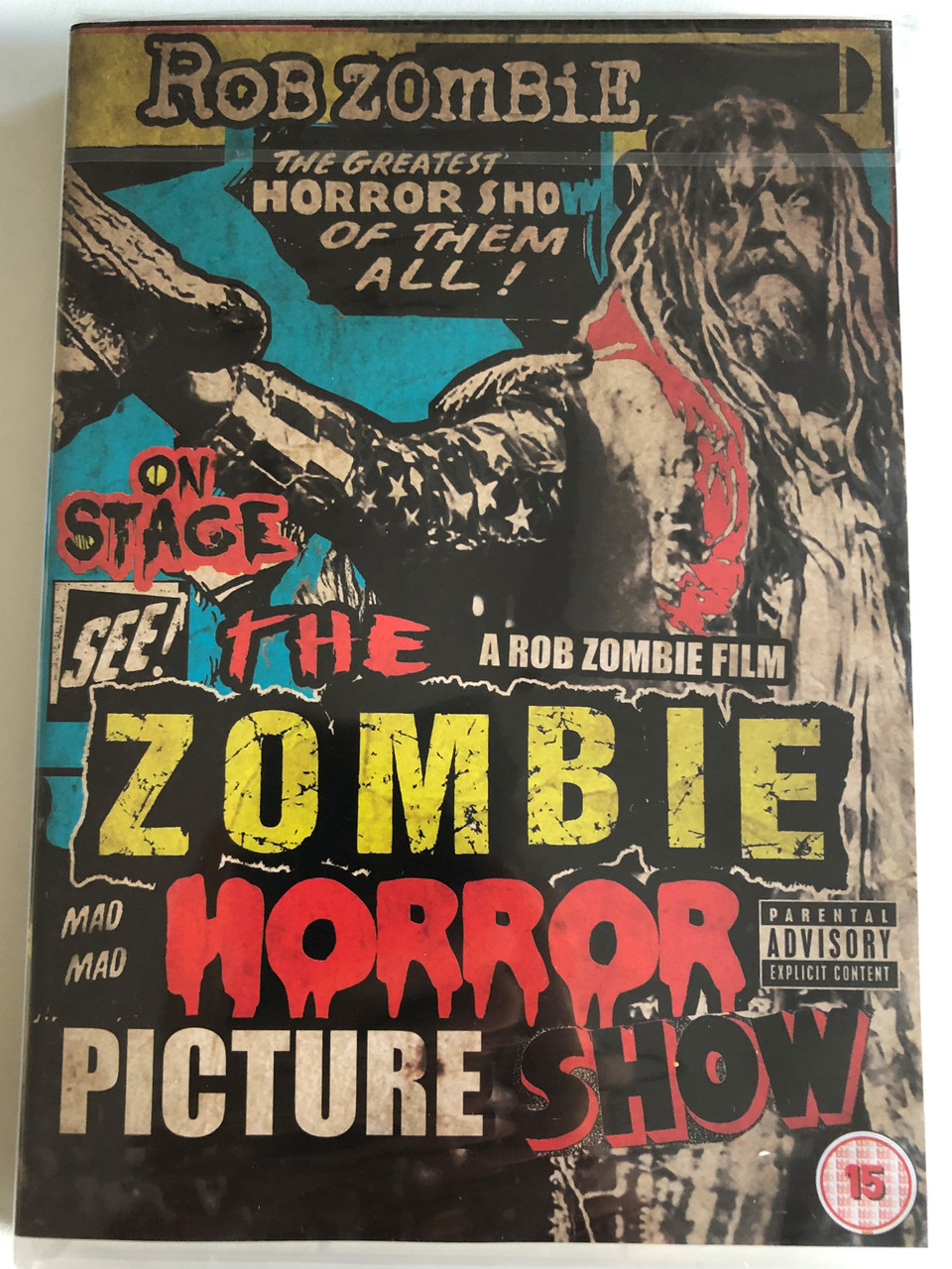 https://cdn10.bigcommerce.com/s-62bdpkt7pb/products/0/images/185950/Rob_Zombie_-_The_Zombie_Horror_Picture_Show_2014_DVD_T-Boy_Records_1__64246.1628004970.1280.1280.JPG?c=2&_gl=1*4gnn4t*_ga*MjAyOTE0ODY1OS4xNTkyNDY2ODc5*_ga_WS2VZYPC6G*MTYyODAwMzkzNC45MS4xLjE2MjgwMDQ3NDguNjA.