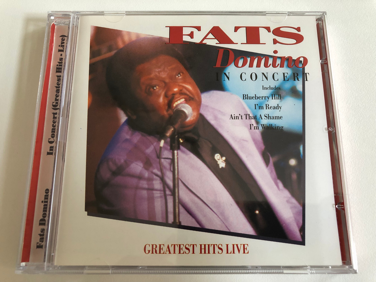 https://cdn10.bigcommerce.com/s-62bdpkt7pb/products/0/images/186271/Fats_Domino_In_Concert_Greatest_Hits_Live_Includes_Blueberry_Hill_Im_Ready_Aint_That_A_Shame_Im_Walking_A_Play_Collection_Audio_CD_1996_10039-2_1__72889.1628182352.1280.1280.JPG?c=2&_gl=1*1fmq222*_ga*MjA2NTIxMjE2MC4xNTkwNTEyNTMy*_ga_WS2VZYPC6G*MTYyODE3ODc5Ni4yMC4xLjE2MjgxODE5OTAuNTg.