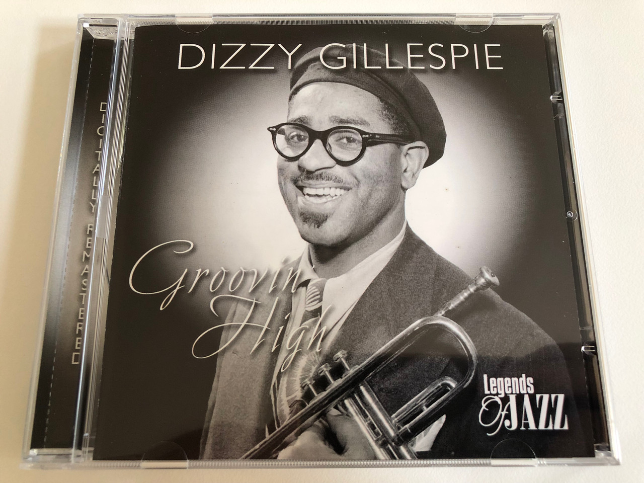 https://cdn10.bigcommerce.com/s-62bdpkt7pb/products/0/images/186309/Dizzy_Gillespie_Groovin_High_Legends_Of_Jazz_Audio_CD_2003_18001-2_1__35682.1628185410.1280.1280.JPG?c=2&_gl=1*1a2jys5*_ga*MjA2NTIxMjE2MC4xNTkwNTEyNTMy*_ga_WS2VZYPC6G*MTYyODE3ODc5Ni4yMC4xLjE2MjgxODUyOTMuNDM.