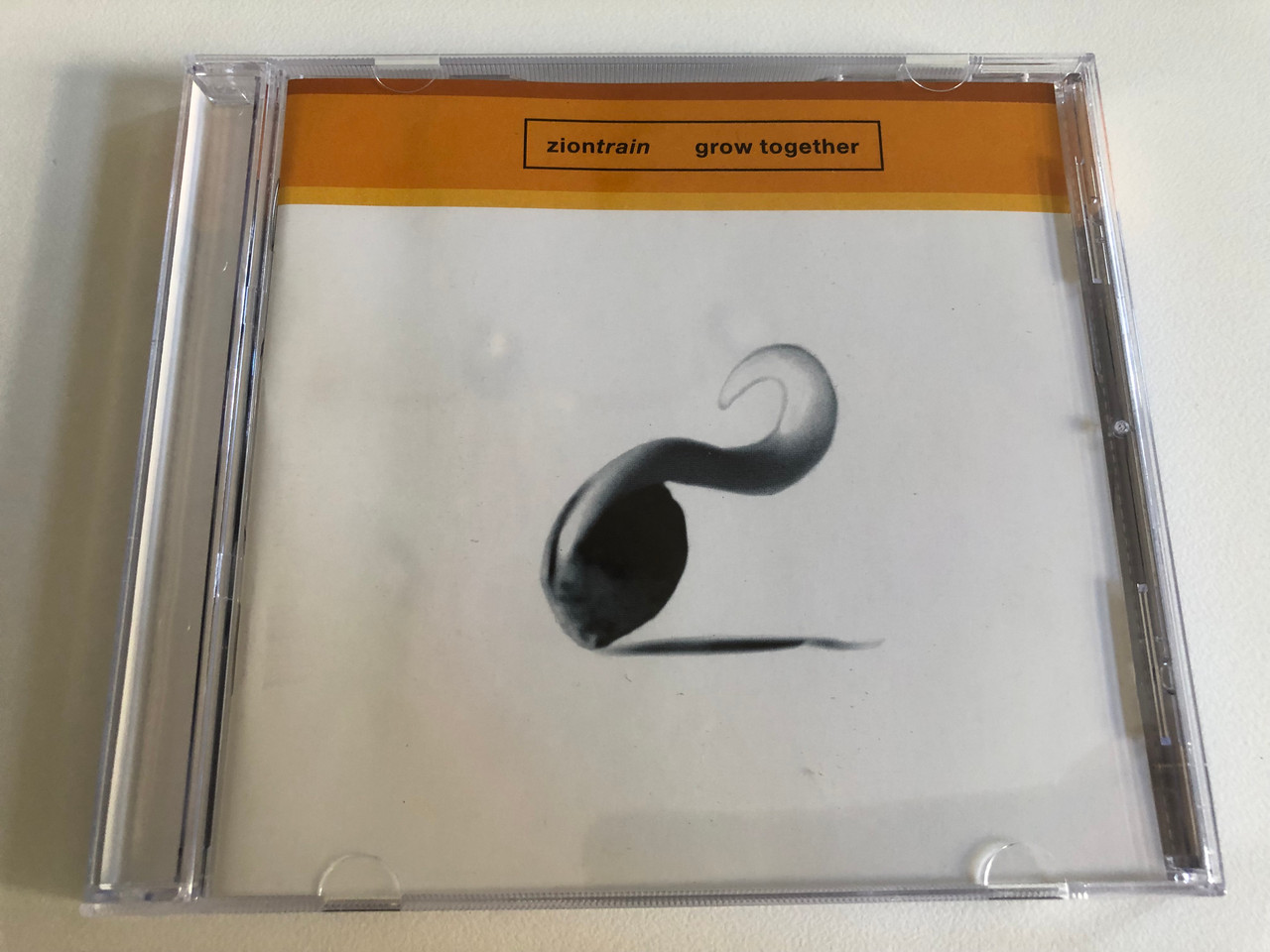 https://cdn10.bigcommerce.com/s-62bdpkt7pb/products/0/images/186606/Zion_Train_Grow_Together_China_Records_Audio_CD_1996_0630-15274-2_1__64149.1628486102.1280.1280.JPG?c=2&_gl=1*1aa3372*_ga*MjA2NTIxMjE2MC4xNTkwNTEyNTMy*_ga_WS2VZYPC6G*MTYyODQ4MTkyOC4yMi4xLjE2Mjg0ODU4NzcuMzI.