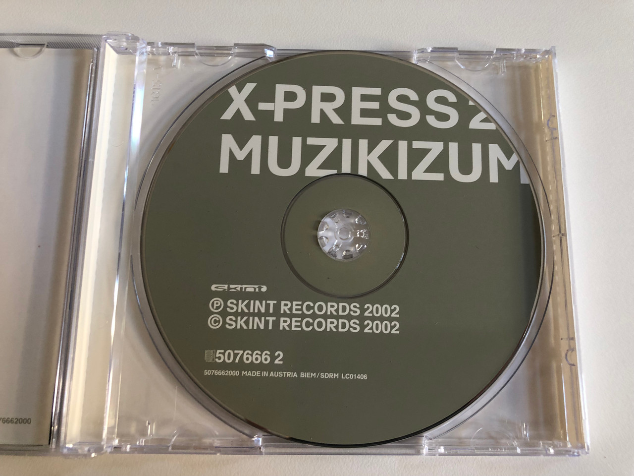 https://cdn10.bigcommerce.com/s-62bdpkt7pb/products/0/images/186609/X-Press_2_Muzikizum_Skint_Audio_CD_2002_507666_2_2__31799.1628486588.1280.1280.JPG?c=2&_gl=1*mw6tdj*_ga*MjA2NTIxMjE2MC4xNTkwNTEyNTMy*_ga_WS2VZYPC6G*MTYyODQ4MTkyOC4yMi4xLjE2Mjg0ODY0MDQuNTg.
