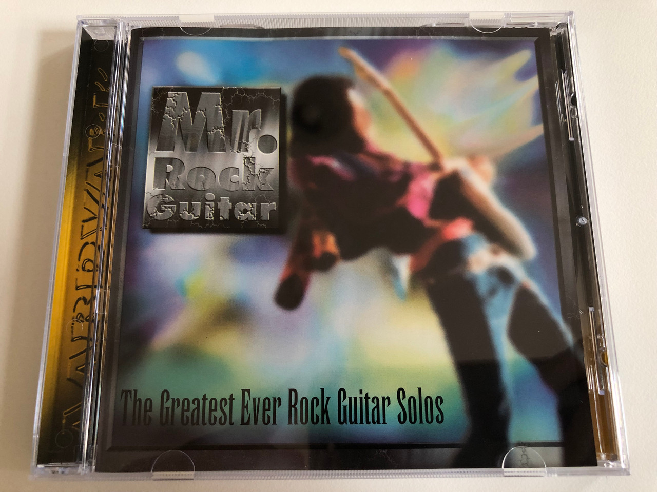 https://cdn10.bigcommerce.com/s-62bdpkt7pb/products/0/images/187029/Mr._Rock_Guitar_-_The_Greatest_Ever_Rock_Guitar_Solos_Aardvark_Audio_CD_1996_ANT017_1__83405.1628668811.1280.1280.JPG?c=2&_gl=1*sfhy7b*_ga*MjA2NTIxMjE2MC4xNTkwNTEyNTMy*_ga_WS2VZYPC6G*MTYyODY2ODg2Ni4yOC4wLjE2Mjg2Njg4NjYuNjA.